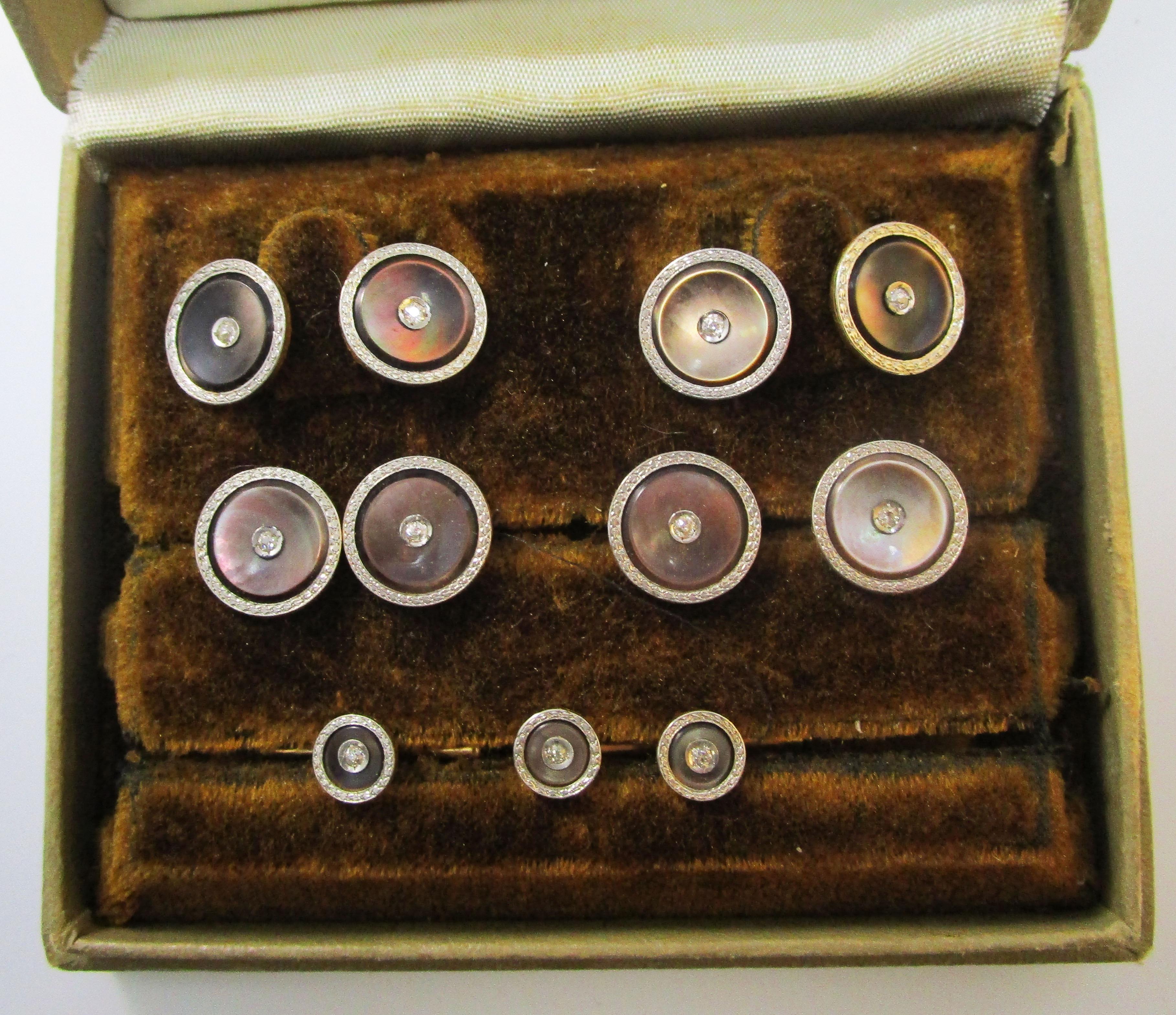 This is a remarkable platinum over gold mother of pearl stud set with diamond centers by Black, Starr & Gorham. The stud set is in fantastic condition and in its box! The combination of platinum, diamonds, and rich mother of pearl makes this set as