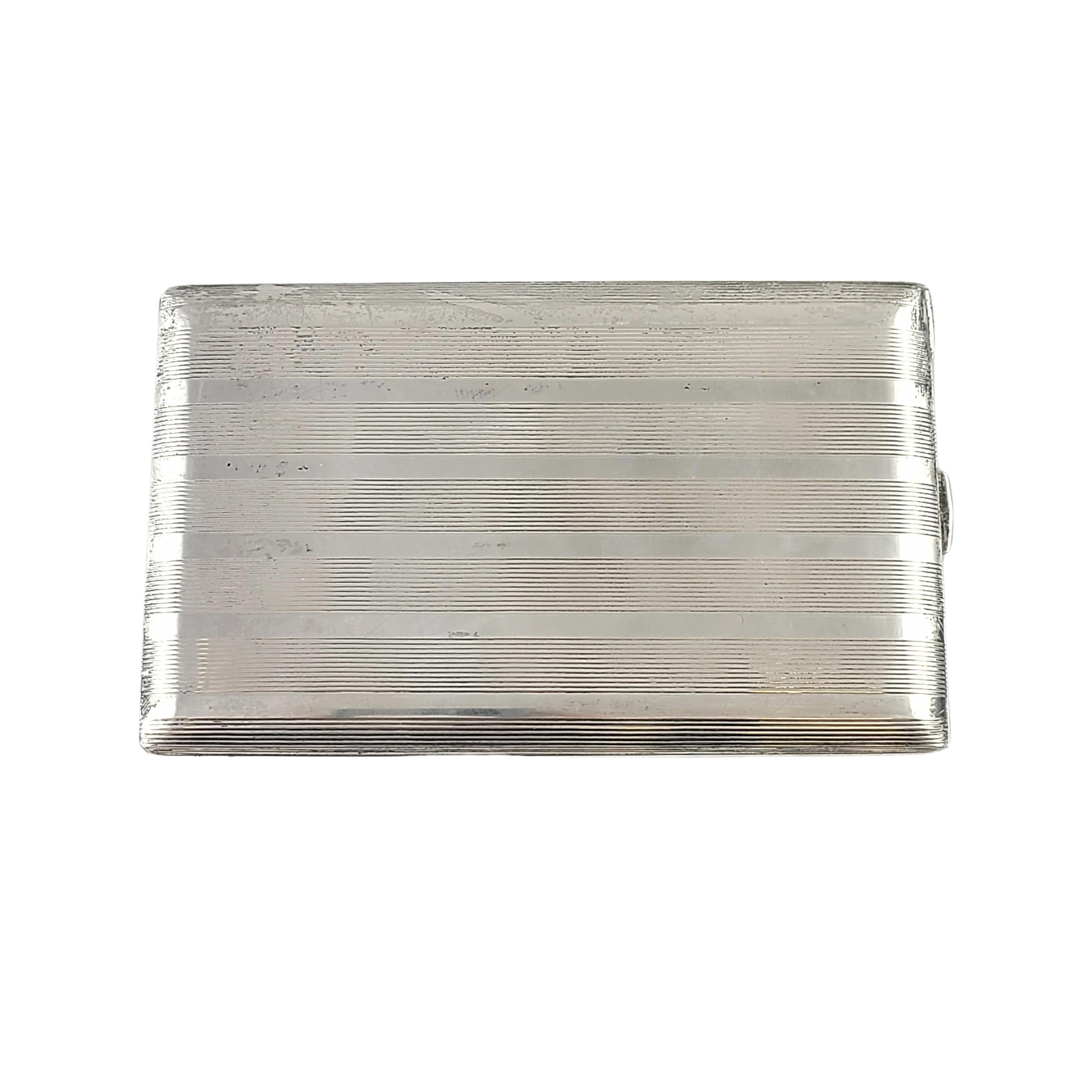 Sterling silver cigarette case by Black Starr & Gorham.

Engraved on the inside lid: FJP MAY 1943 FROM E. AND A. DOUGLAS

Black Starr & Gorham was a prominent manufacturer of silverware from 1940-1962. This piece features a banded etched striped