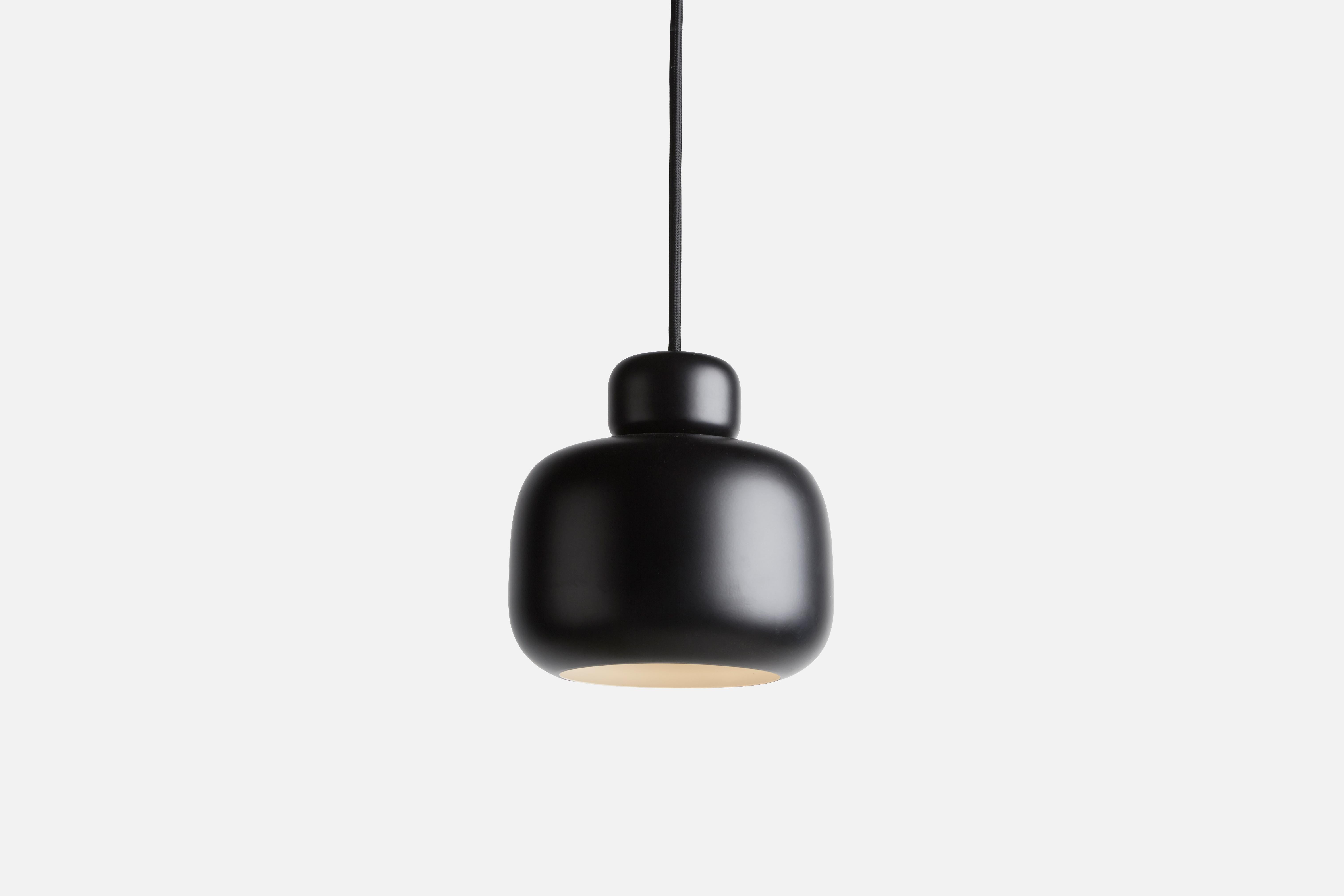 Black Stone pendant lamp by Philip Bro
Materials: Metal.
Dimensions: D 15.9 x H 16 cm
Available in yellow, white and black.

Philip Bro is an experienced Danish designer with a drive to prove that serious design can still be stylish, playful