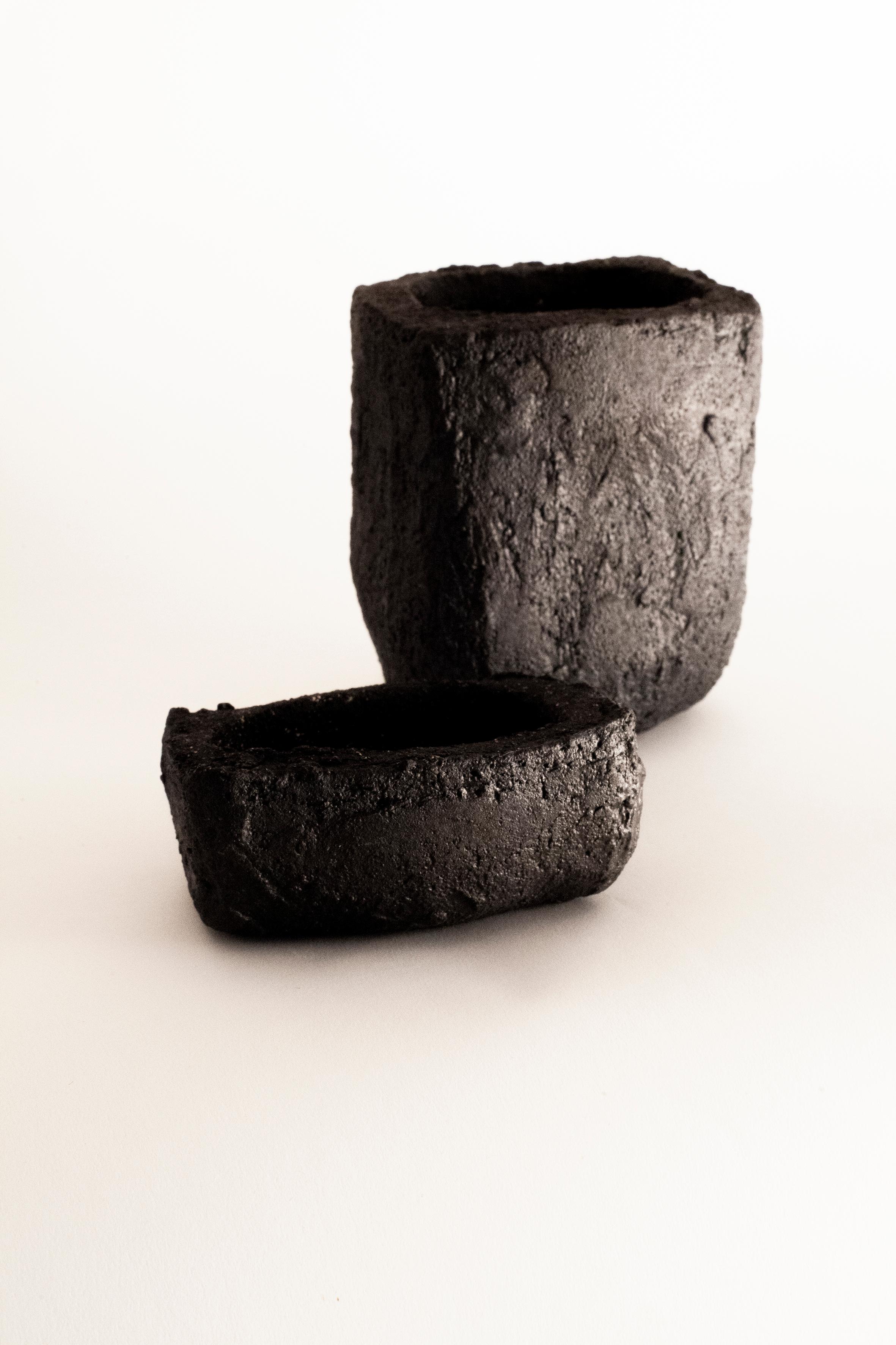 A unique stoneware box by Danish artist Christine Roland. Made from gritty, black stoneware with a silvery, black finish, referencing the artists Nordic background and dark, Scandinavian Winters. A decorative object or container for precious items.
