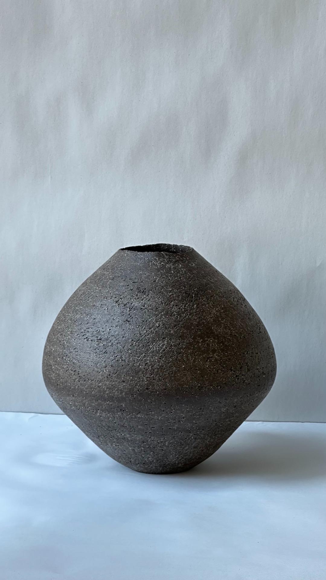 Black Stoneware Sfondyli Vase by Elena Vasilantonaki
Unique
Dimensions: ⌀ 27 x H 23 cm (Dimensions may vary)
Materials: Stoneware
Available finishes: Black, White, Brown, Red, White Patina

Growing up in Greece I was surrounded by pottery forms that