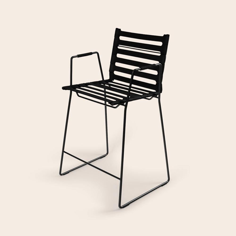 Black strap bar chair by OxDenmarq
Dimensions: D 45 x W 45 x H 104 cm
Materials: Leather, Black Powder Coated Steel
Also available: Different colors available.

OX DENMARQ is a Danish design brand aspiring to make beautiful handmade furniture,