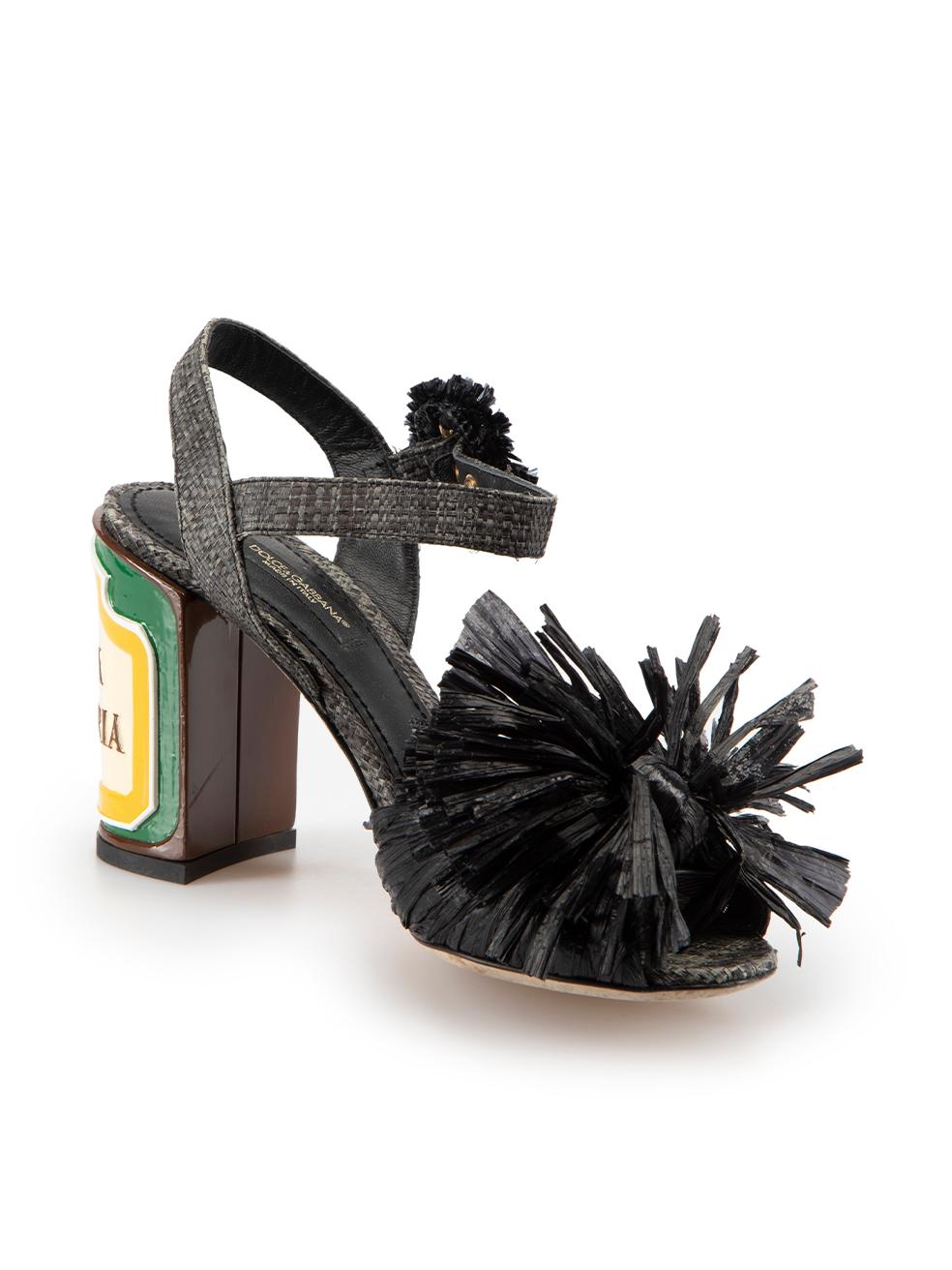 CONDITION is Very good. Minimal wear to sandals is evident. Minimal wear to the left shoe heel with small chip on this used Dolce & Gabbana designer resale item.



Details


Black

Straw

Heeled sandals

Raffia detail

High block heel

Multicolour