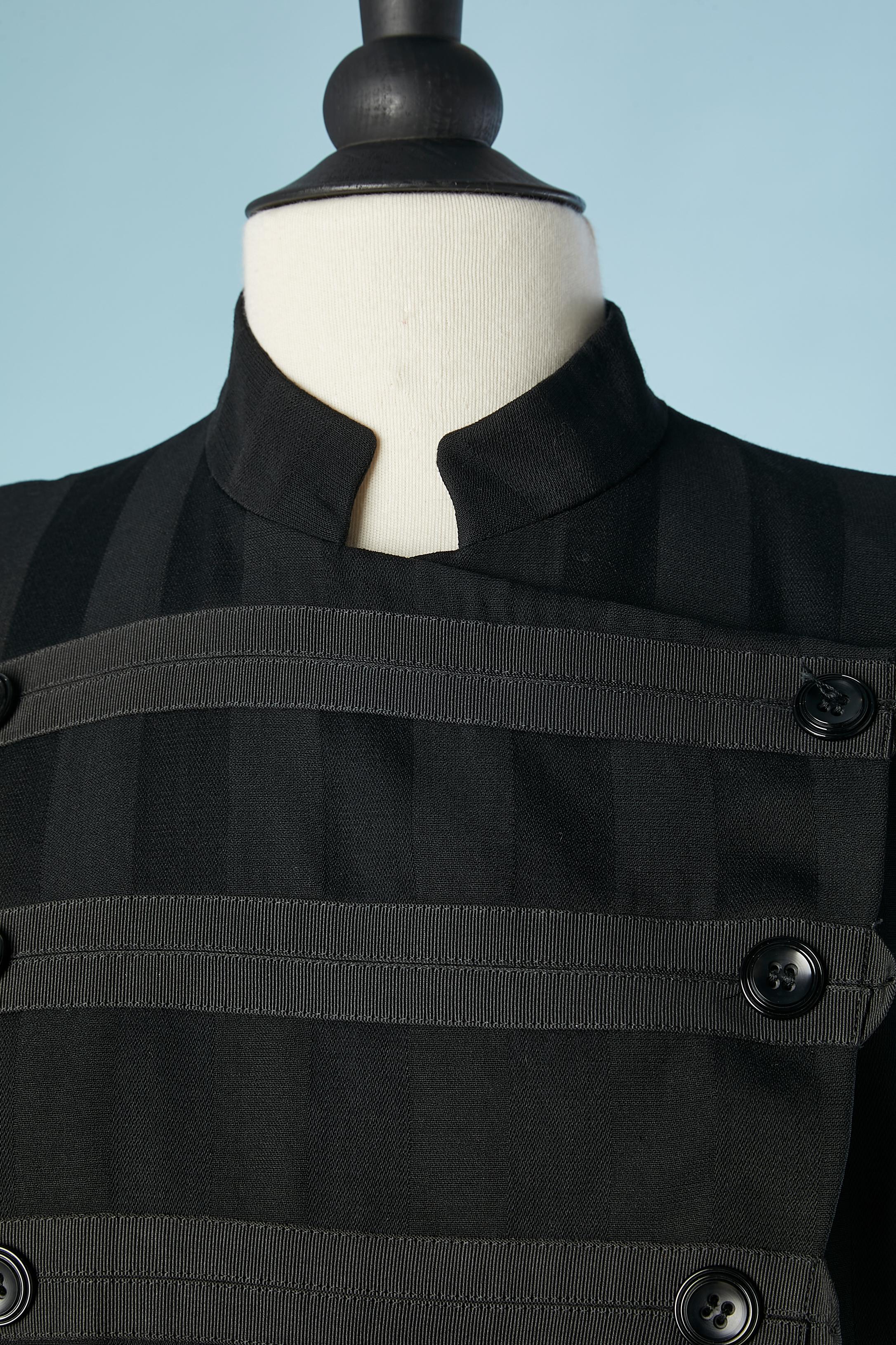 Black striped officier double-breasted wool jacket. Lining composition: acetate. Trimming: cotton
Shoulder-pad. 
SIZE M 