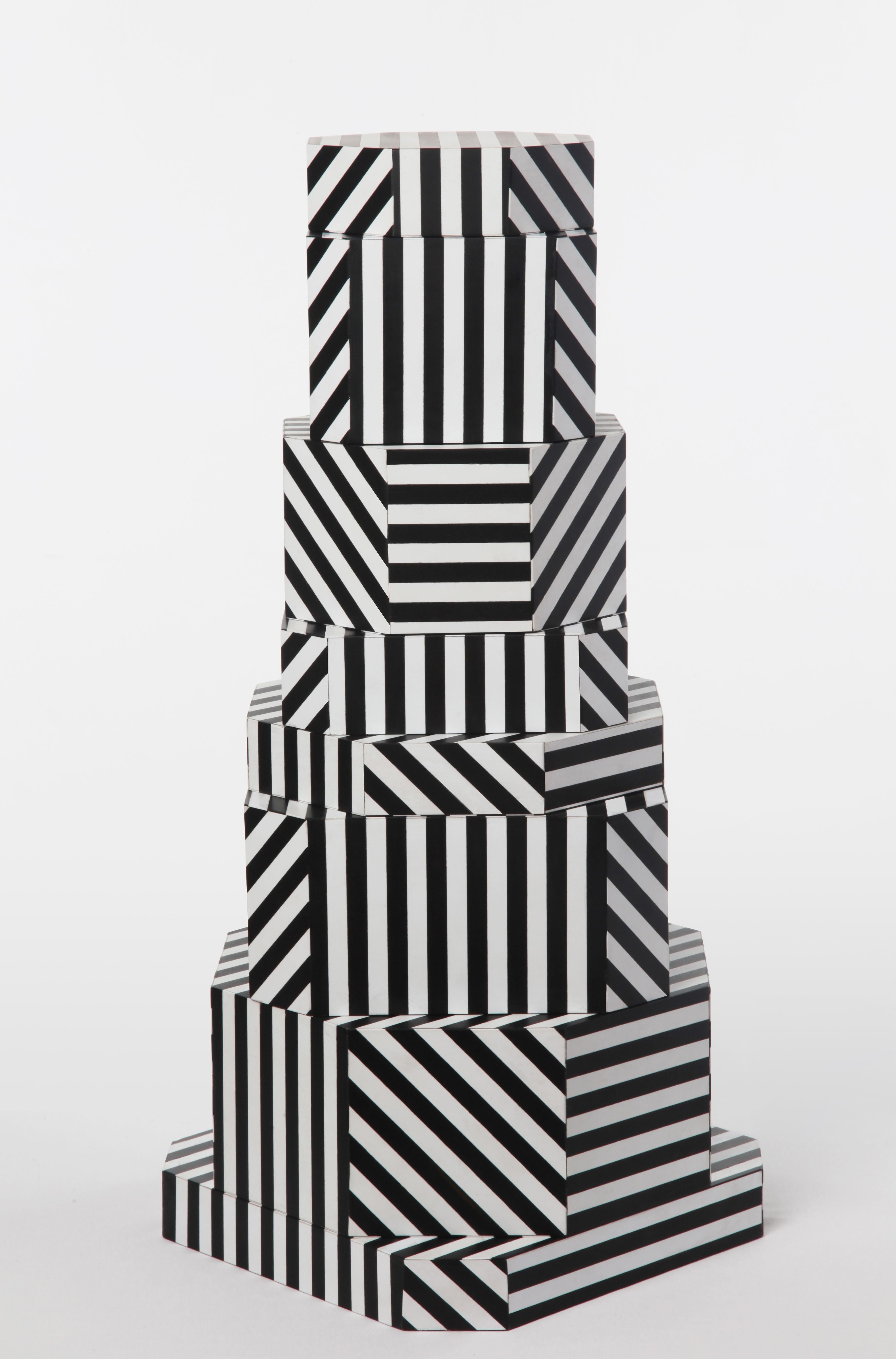 Black Stripes Ziggurat boxes by Oeuffice
Edition: 12 + 2AP
2012
Dimensions: 25 x 25 x 55 cm
Materials: Wood box, acrylic, solid stained wood

The black Stripes edition evokes bold and linear details akin to Optical
Art. With a rich inlaid