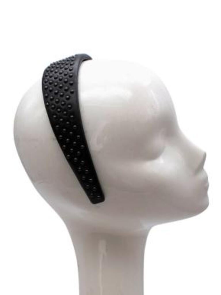 Dior Black Studded Leather Hairband
 

 - All over rounded stud details 
 - Supple black leather body 
 - Slip on
 - Tight fitting 
 

 Material:
 Leather 
 

 PLEASE NOTE, THESE ITEMS ARE PRE-OWNED AND MAY SHOW SIGNS OF BEING
 STORED EVEN WHEN