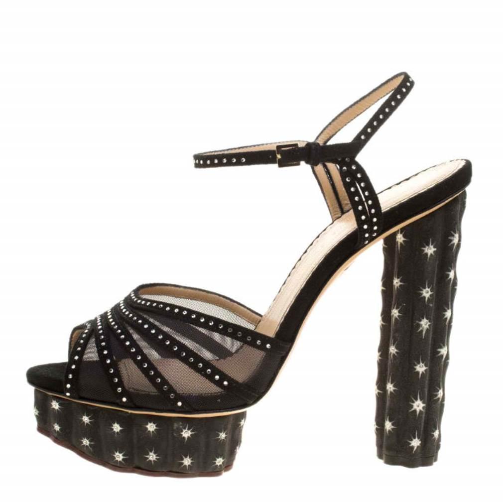 These black Cactus sandals from Charlotte Olympia, exuding a glamorous finish, are ideal for the fashion-forward women. Their exterior is beautifully designed with a mesh and suede frontal strap embellished with studs akin to the ankle straps that
