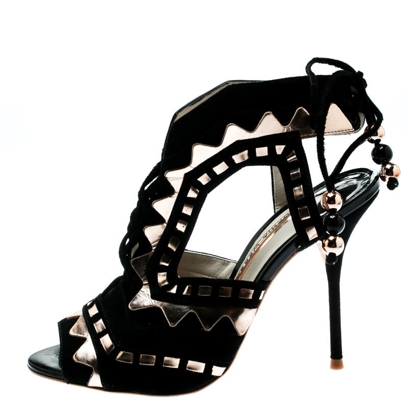These sandals evidently exhibit why people in search for something exclusive go to Sophia Webster. These Rico sandals are crafted from black suede and metallic bronze leather. They flaunt an intriguing cut out pattern all over along with a unique