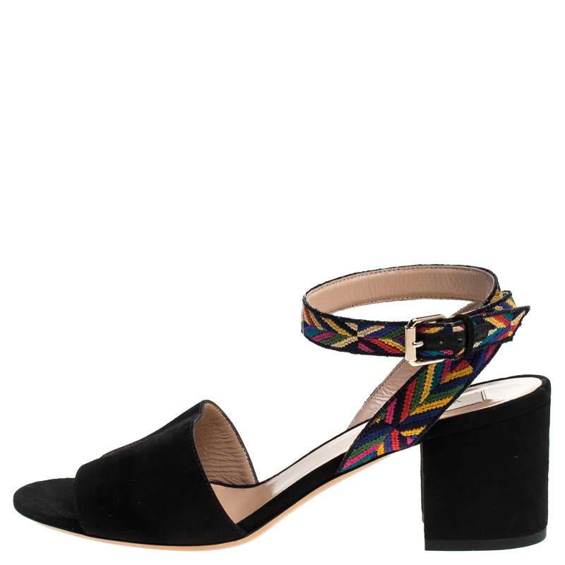 A perfect mix of elegant fashion and sophisticated style, these Valentino sandals come crafted from black suede and are designed with multicolored fabric ankle straps that come secured with buckles. They're visually stunning and they are elevated on