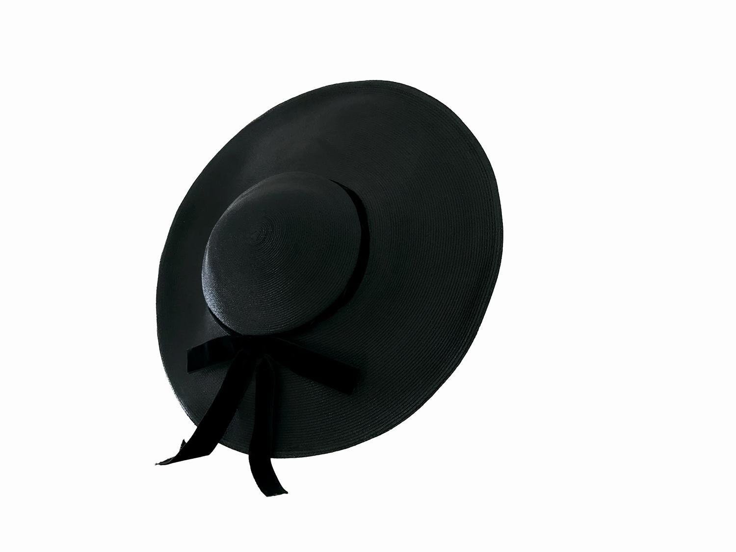 Extremely rare original H.Liebes & Co. hat, assuming early 20th century regarding the documentation.
Stunning wide-brim black straw hat, combining timeless elegance with a fashion-forward sensibility. Its , dramatic brim gives it a bold silhouette