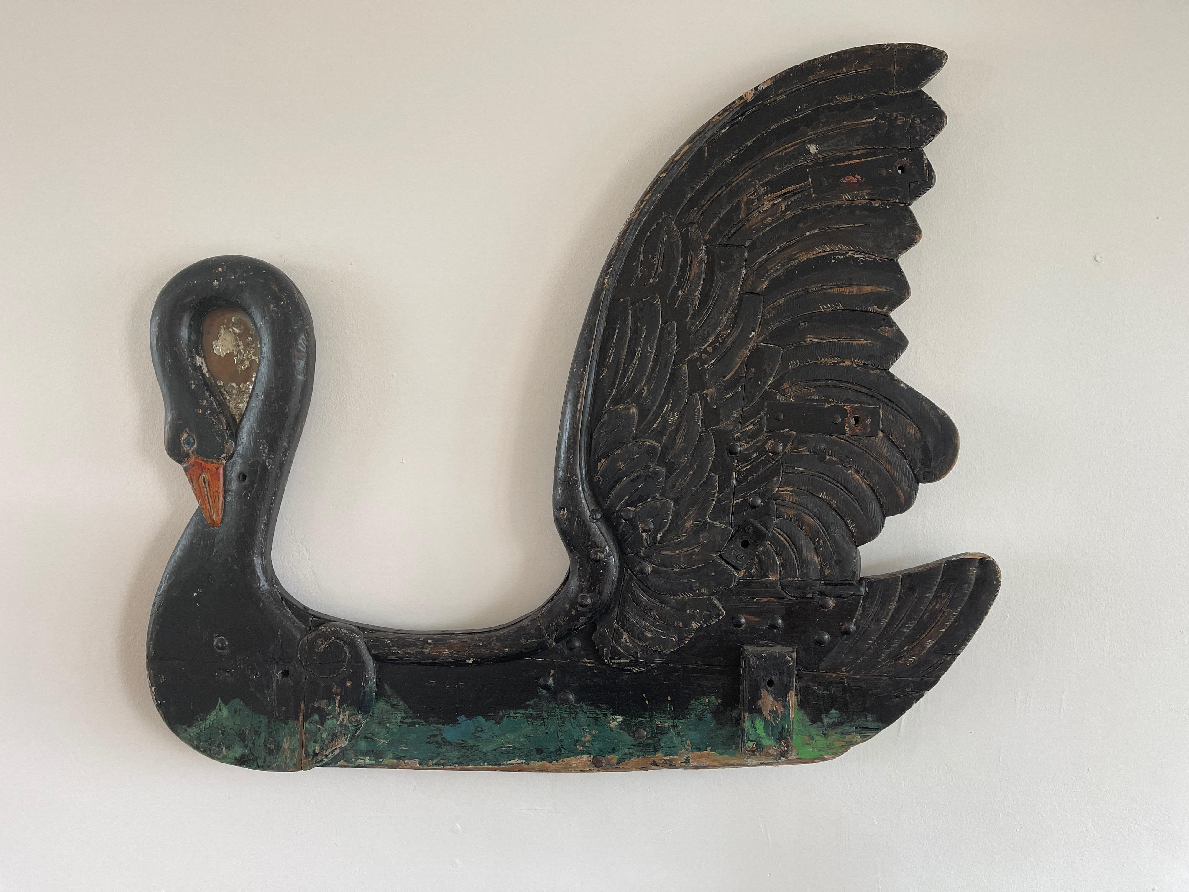 Early carved wood carousel in shape of Black Swan 

Wonderful patina.