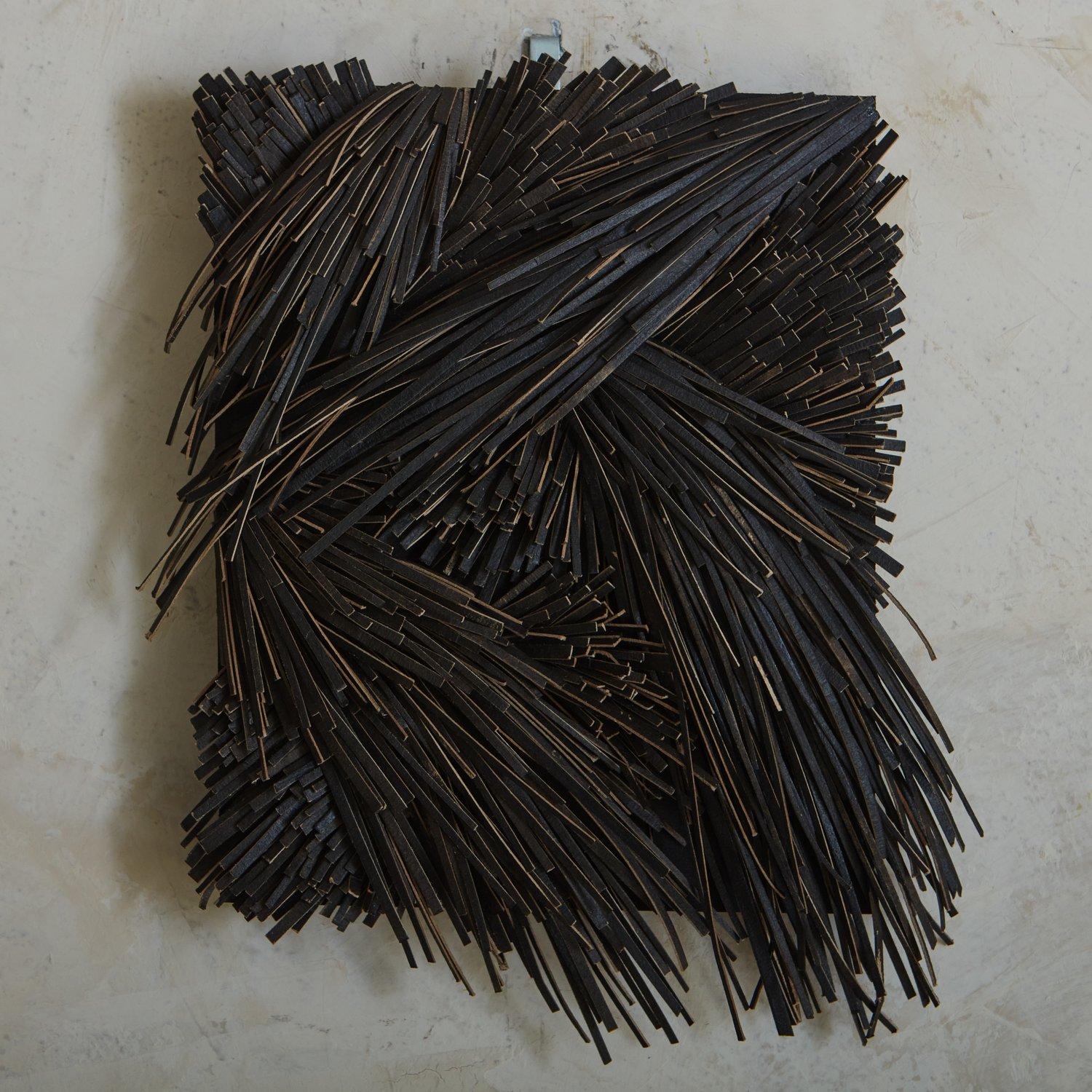 A textural wall sculpture made from recycled cardboard, ink, acrylic and wood by Canadian artist Erin Vincent. Signed and dated en verso. Hanging hardware included.

Erin Vincent is a Canadian artist who creates sculptural wall art and