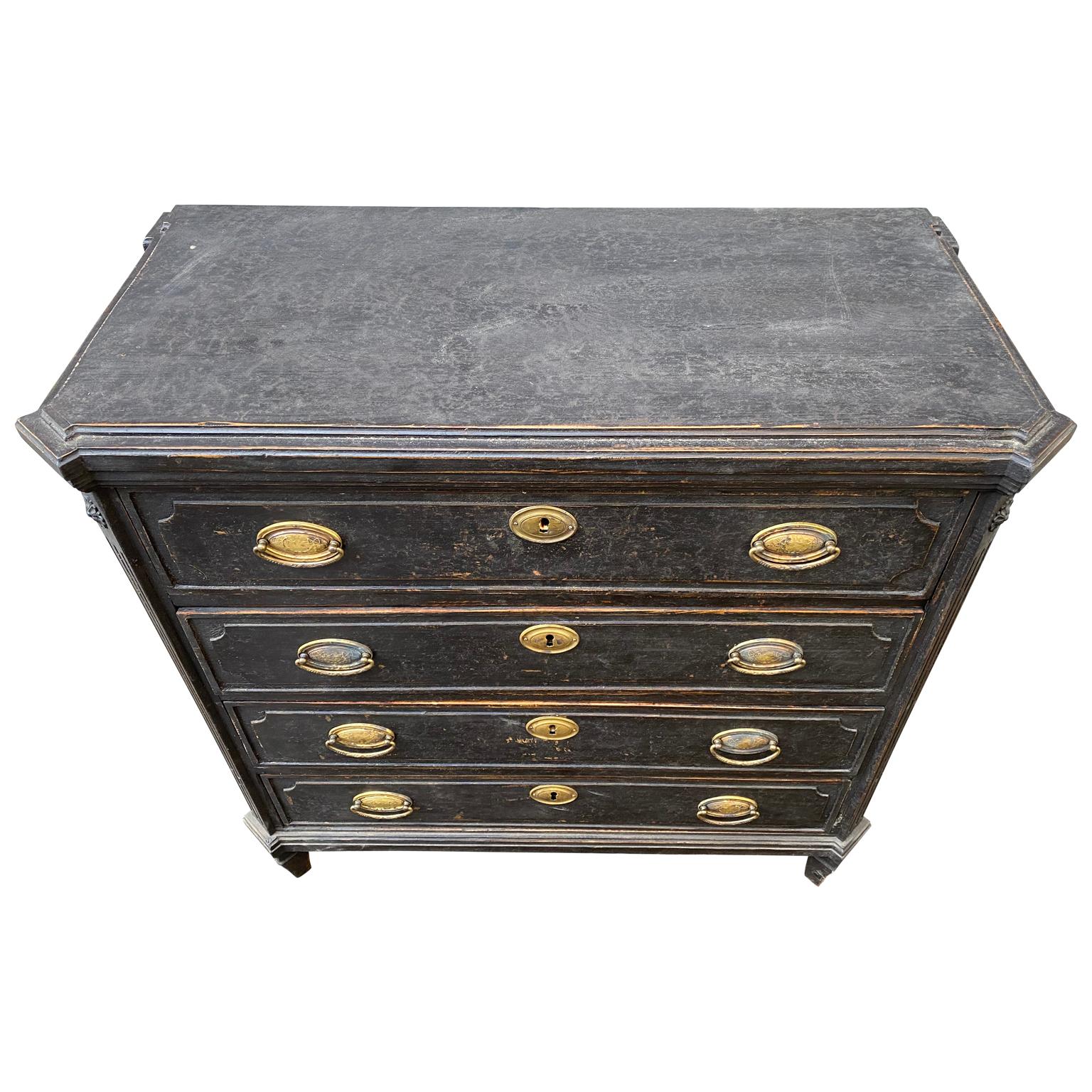 Gustavian black painted 4 drawer chest of drawers with brass hardware.