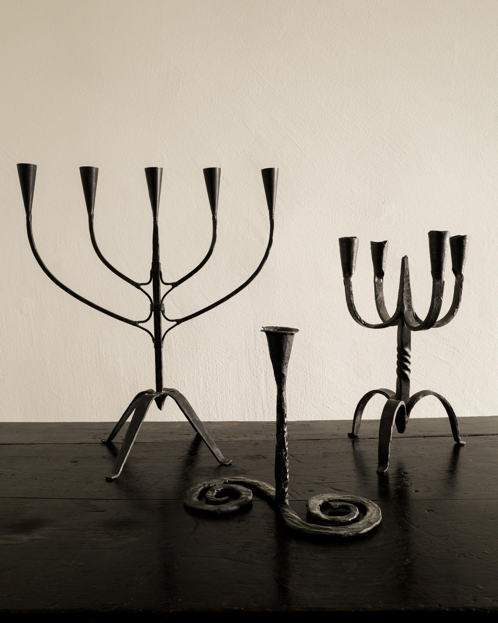 Rare set of three antique sculptural candleholders in black cast iron produced in Sweden late 1800s. In good original condition. 

Dimensions: 
Large: H: 41 cm / 16.15