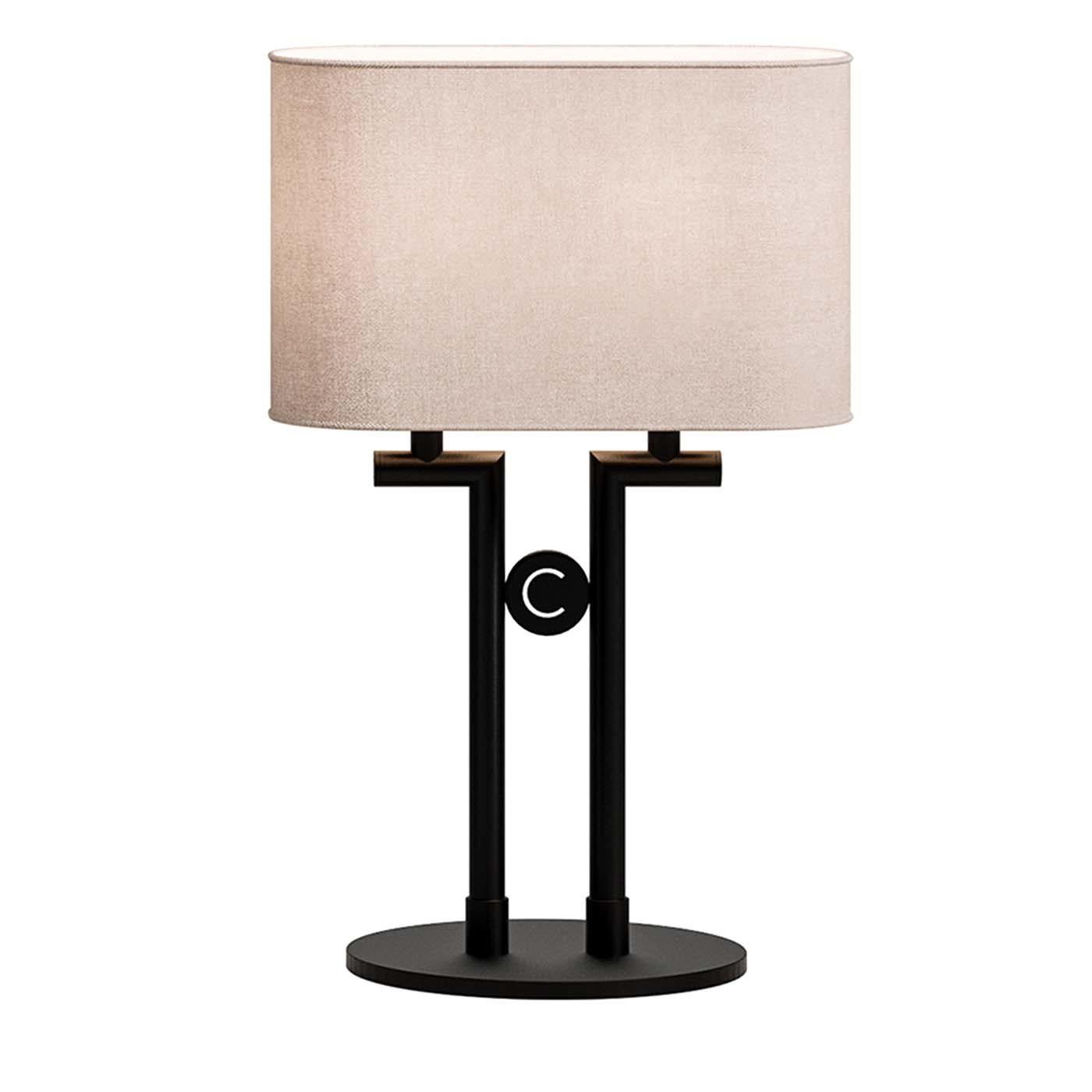 Sleek and refined, this table lamp merges contemporary and traditional styles in a striking silhouette that will stand out in any interior. The captivating base is crafted of metal with a black finish and is made of a round plate with two