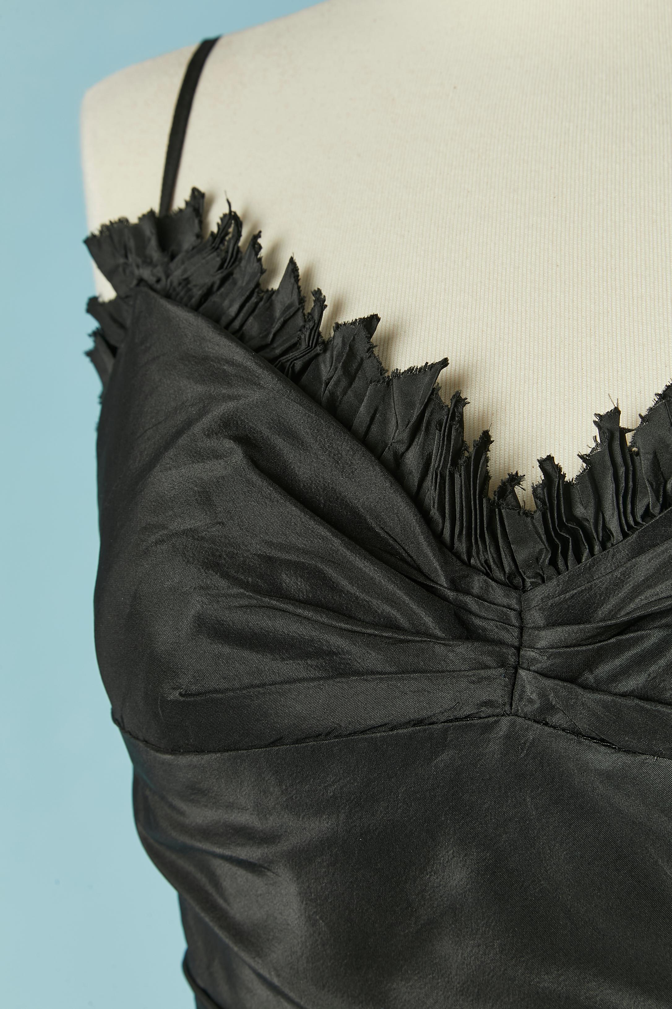 Black taffetas cocktail dress with ruffles. Tulle petticoat lining. Lightly padded bra. Zip closure on the middle back + hook&eye. Boned. 
SIZE 10 (UK) 