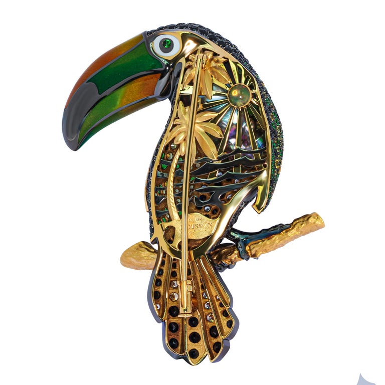 Black Tahiti Pearl, Diamonds, Multicolor Enamel, Sapphires 18 Karat Yellow Gold Tucano Brooch.
There is whole Brasil in this bird. Signior Tucano will show You unseen colours of the rain forest. Just look on his backside and feel endless party on