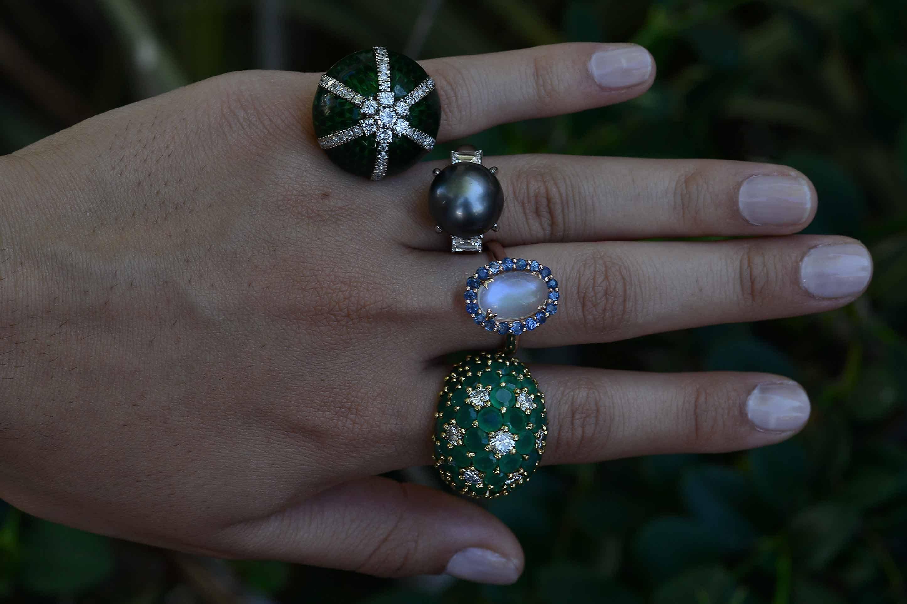 The Santa Fe Statement Ring. An elegant and simple cocktail ring you can wear every day, features a large and lustrous 13mm black Tahitian pearl embraced by a pair of icy-white, fiery baguette diamonds just shy of 1 carat. This 3 stone trinity is a