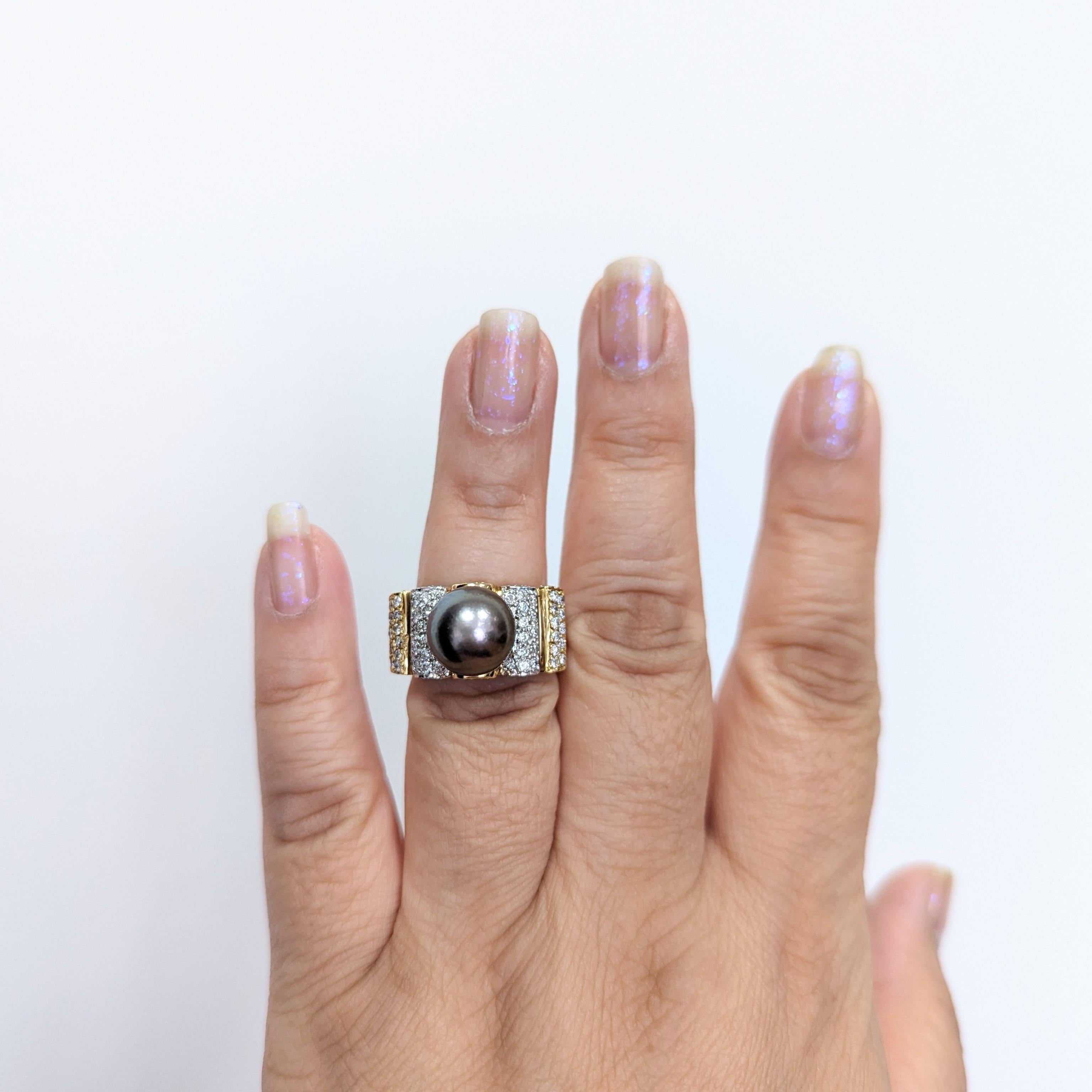 Beautiful black Tahitian pearl with 0.85 ct. white diamond round pave.  Handmade in 18k white and yellow gold.  Ring size 7.
