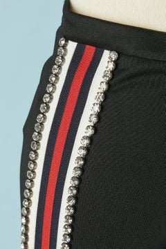 Black tapered trousers with striped and rhinestone trimming Gucci