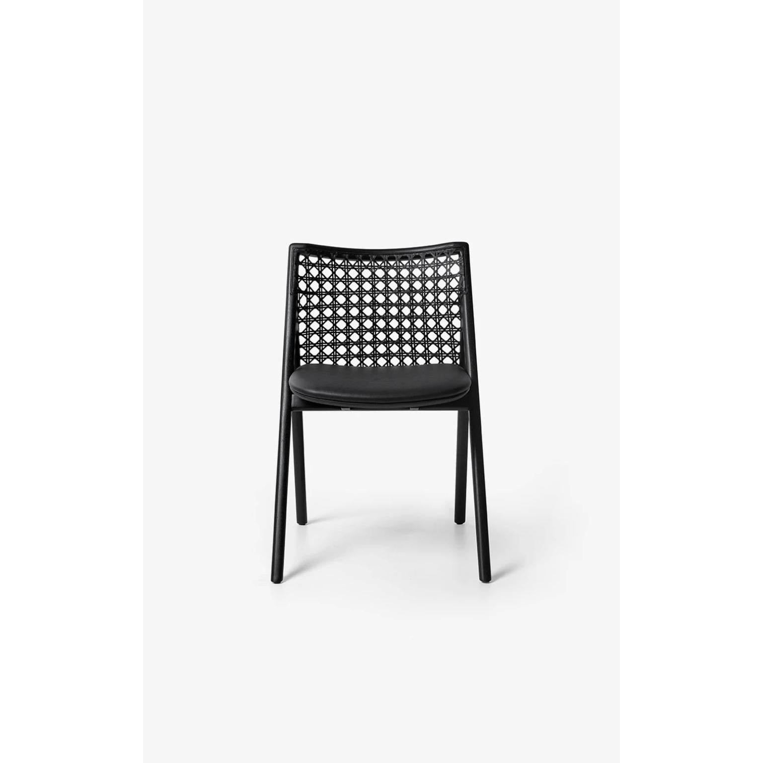 Black Tela Chair by Wentz
Dimensions: D 54 x W 55 x H 80 cm
Materials: Tauari Wood, Cotton, Weave, Plywood, Upholstery.
Weight: 5,4kg / 11,9 lbs

The Tela armchair is a meeting between contemporary design and traditional Brazilian materials. The