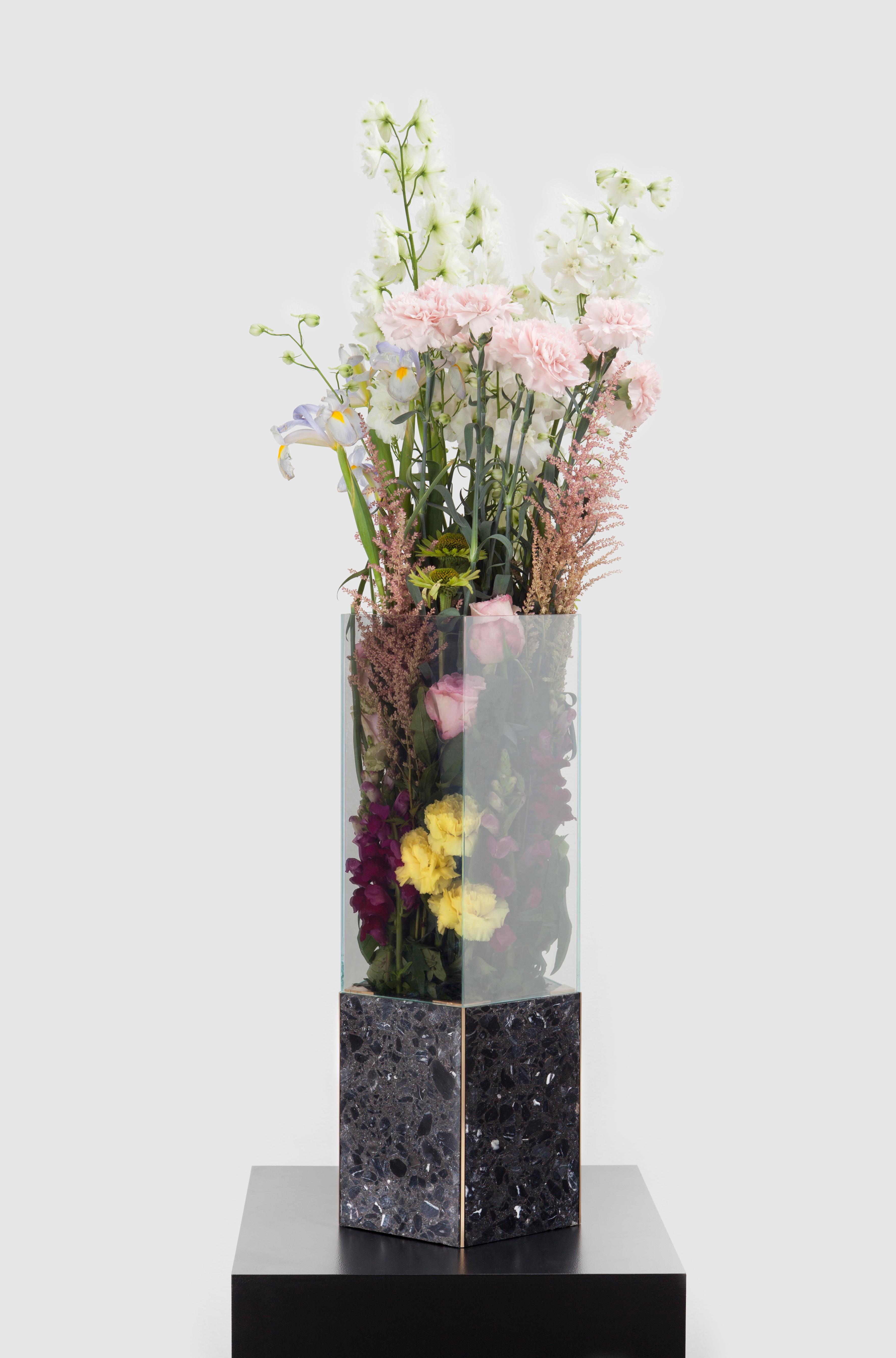 Black Terrazo Pentagonal Narcissus vase by Tino Seubert
Dimensions: Ø24 x H 60 cm.
Materials: Black terrazzo, brass, mirrored glass.

Tino Seubert
When he first made his now signature wicker and aluminium stools and benches in 2018 for a show