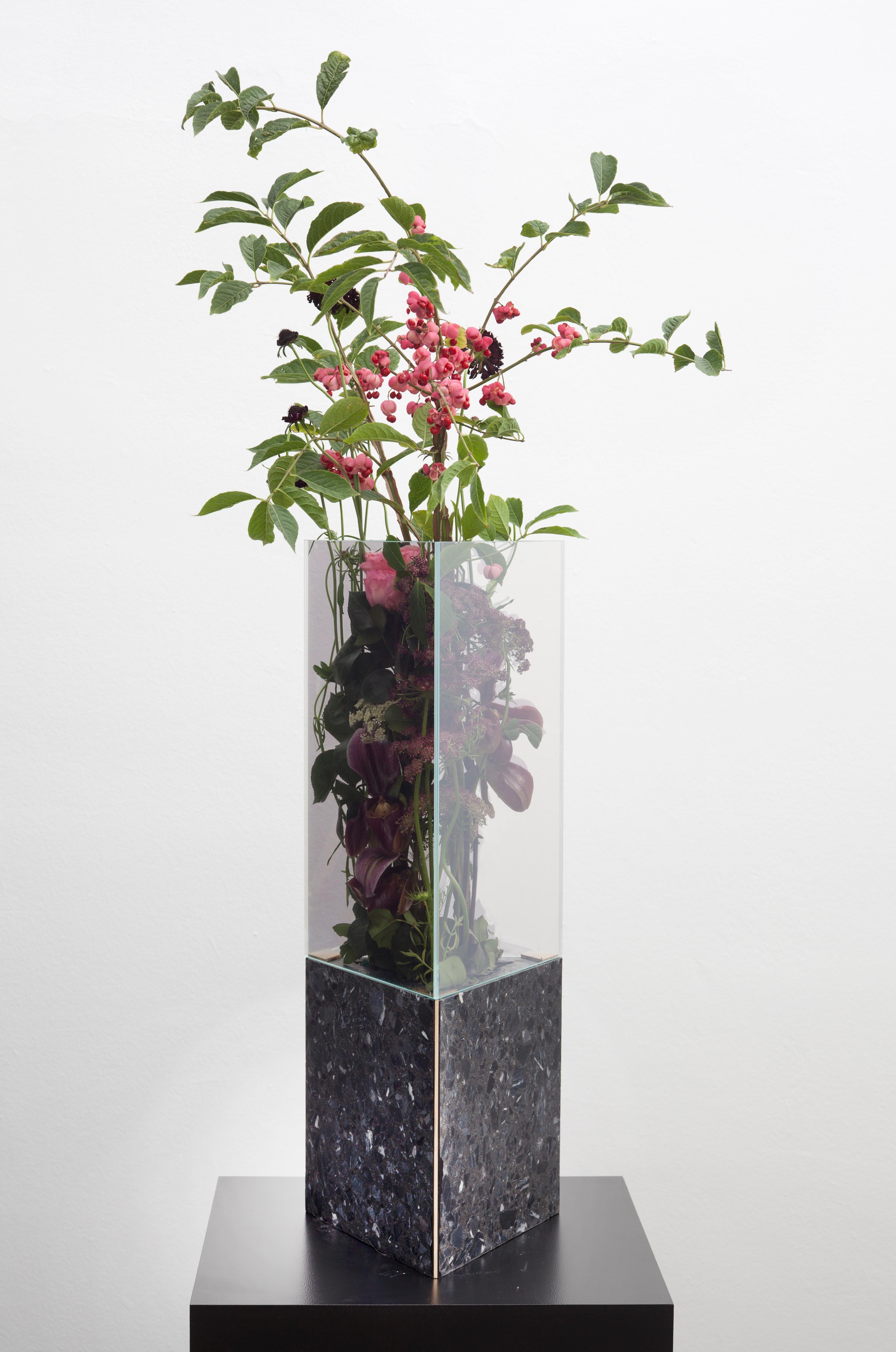 Black Terrazo Triangular Narcissus vase by Tino Seubert
Dimensions: D 20.8 x W 24 x H 62.8 cm.
Materials: Black terrazzo, brass, mirrored glass.

Tino Seubert
When he first made his now signature wicker and aluminium stools and benches in 2018