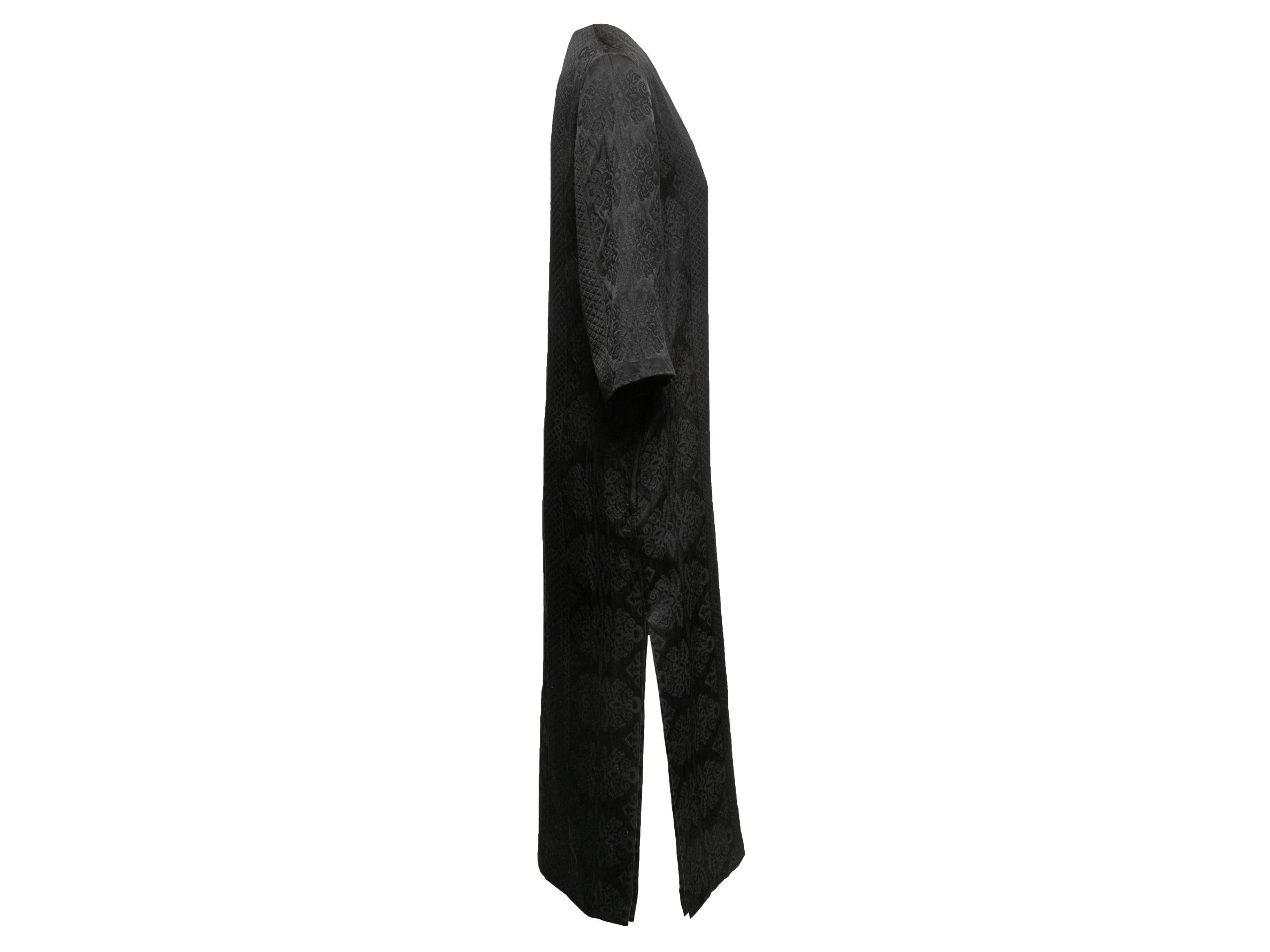 Black patterned maxi dress by The Row. V-neck. Three-quarter sleeves. 40
