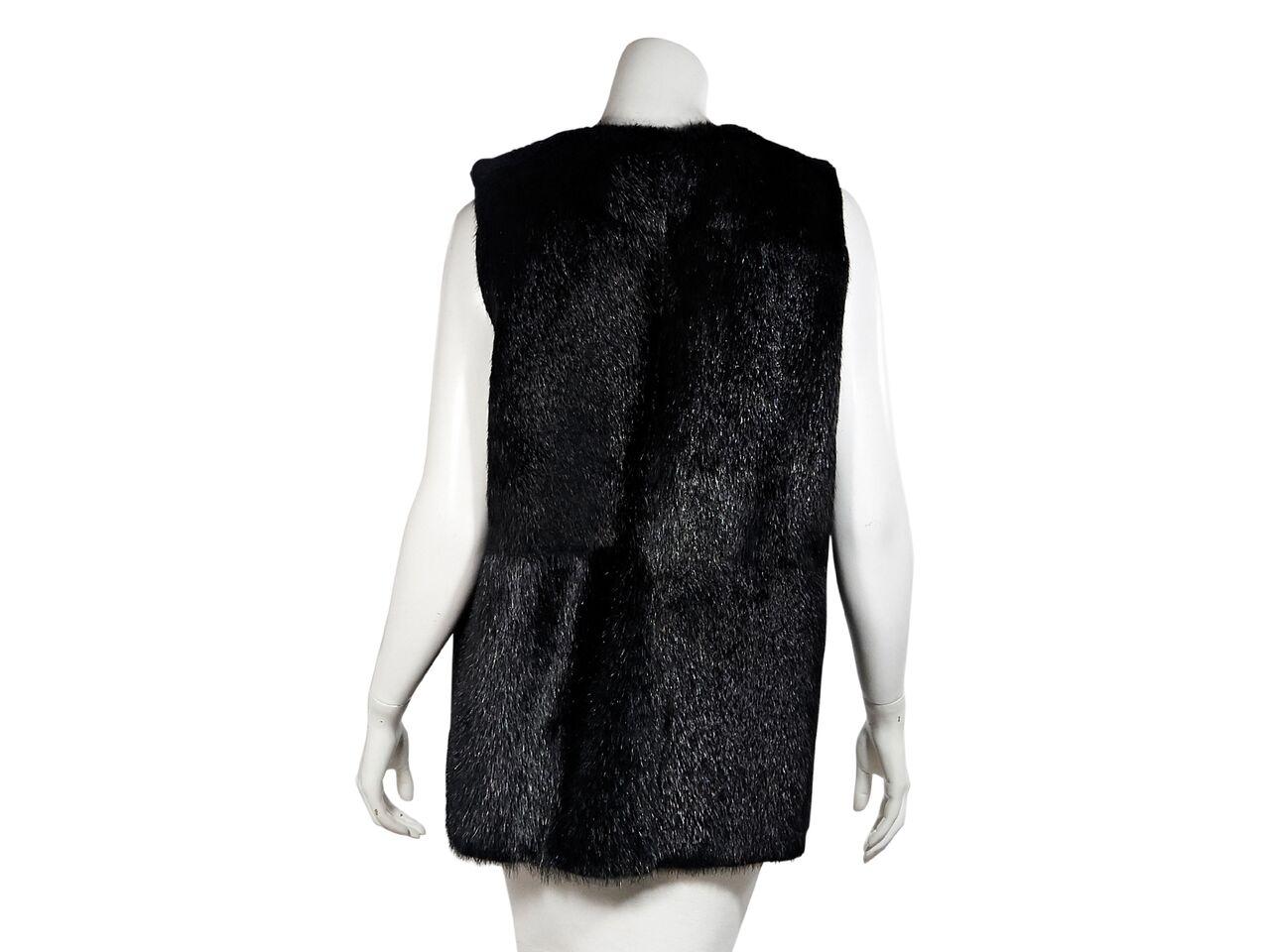 Product details:  Black nutria fur long vest by Theory.  Jewelneck.  Sleeveless.  Concealed hook and eye closure.  36