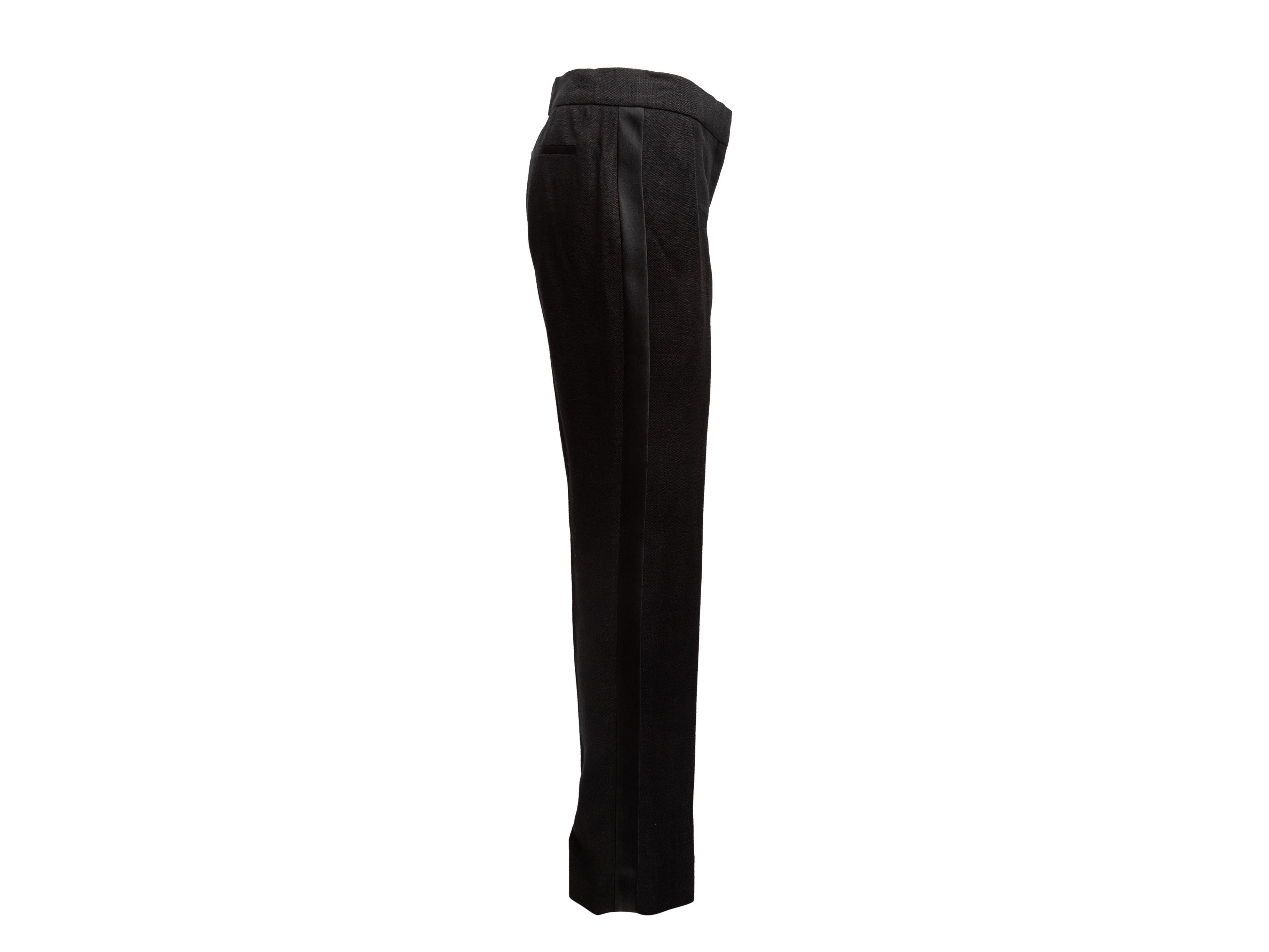 Product Details: Black linen and satin straight-leg trousers by Tom Ford. Dual back pockets. Zip closure at front. 30