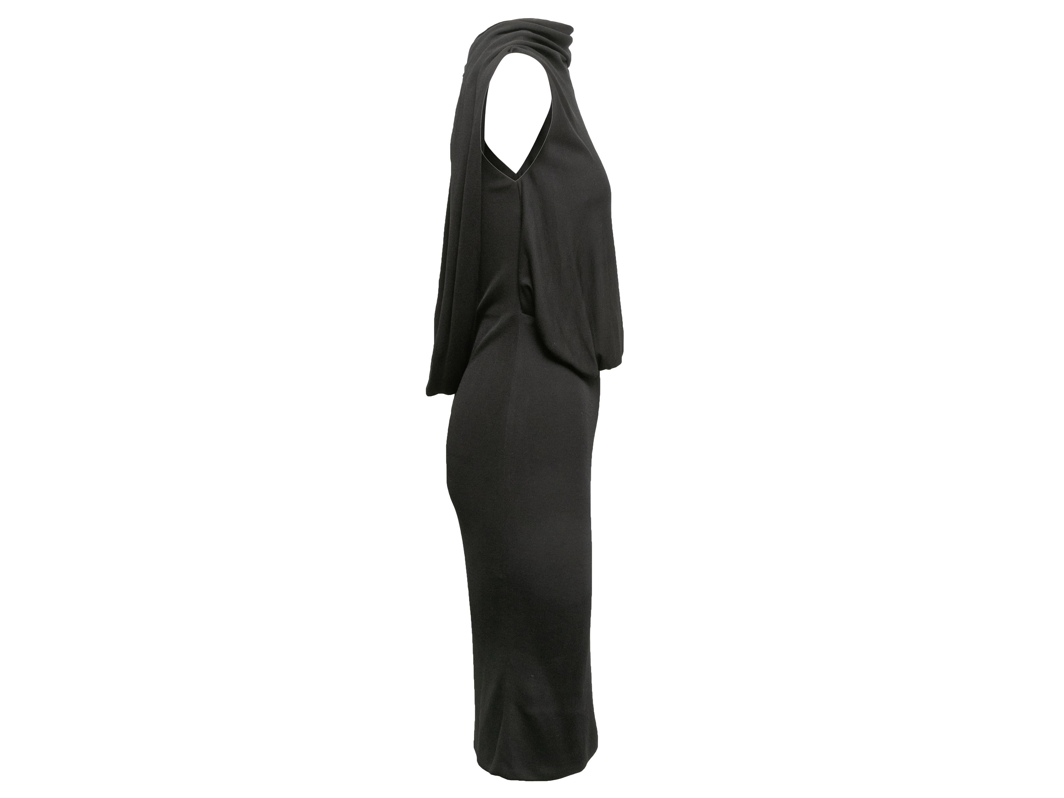 Product Details: Black silk sleeveless dress by Tom Ford. Bateau neckline. Draping at front and back. Zip closure at center back. 32