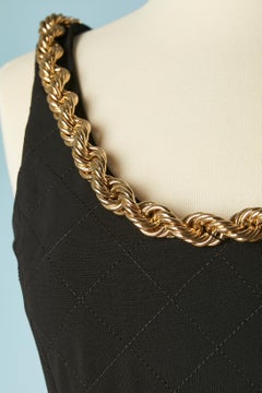 Black top stitched cocktail dress with gold metal chain edge Moschino Couture