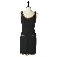Black top stitched cocktail dress with gold metal chain edge Moschino Couture 