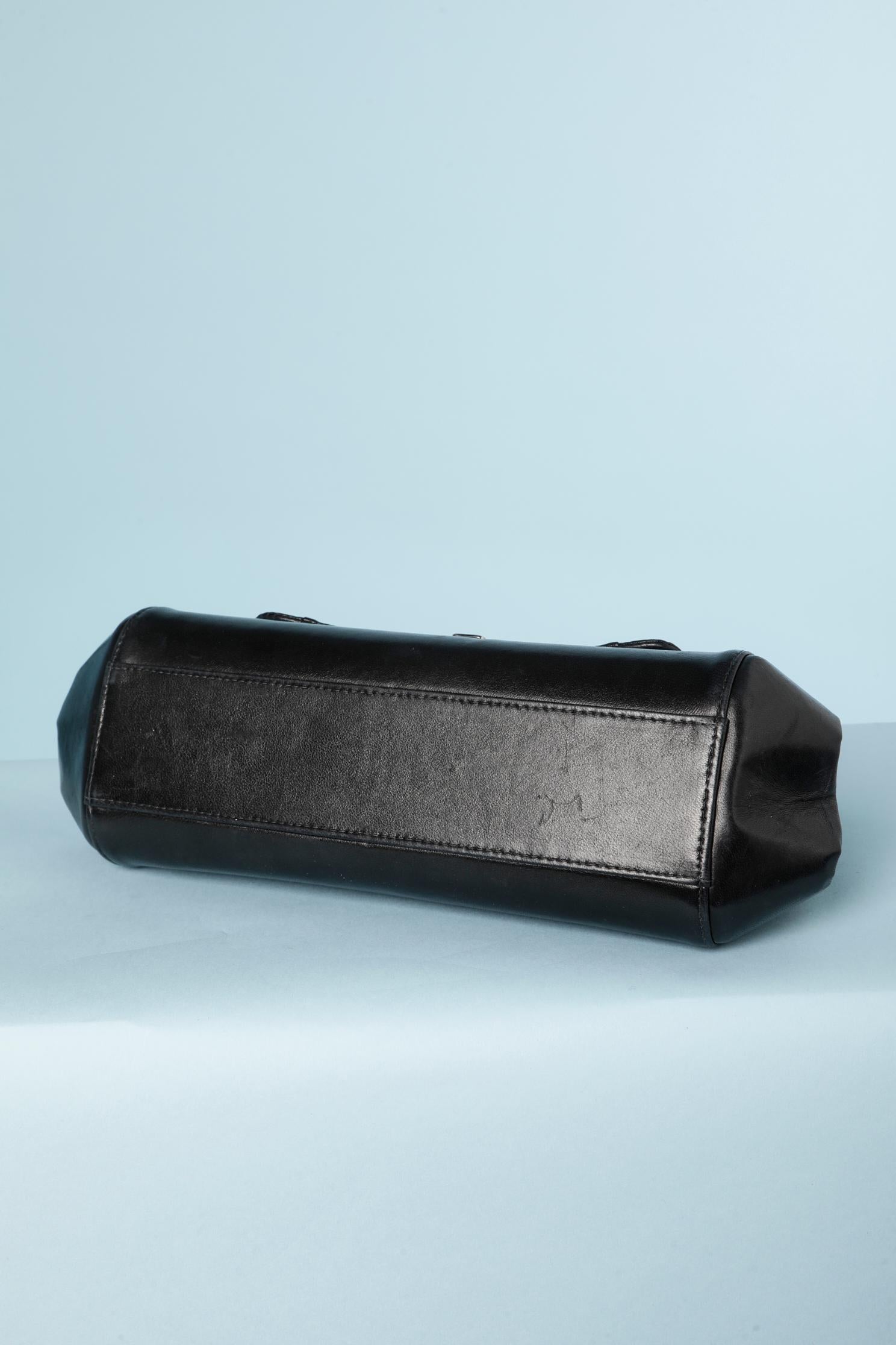 Sac en cuir noir surpiqué « Baguette » Chanel ( numéroté) 1