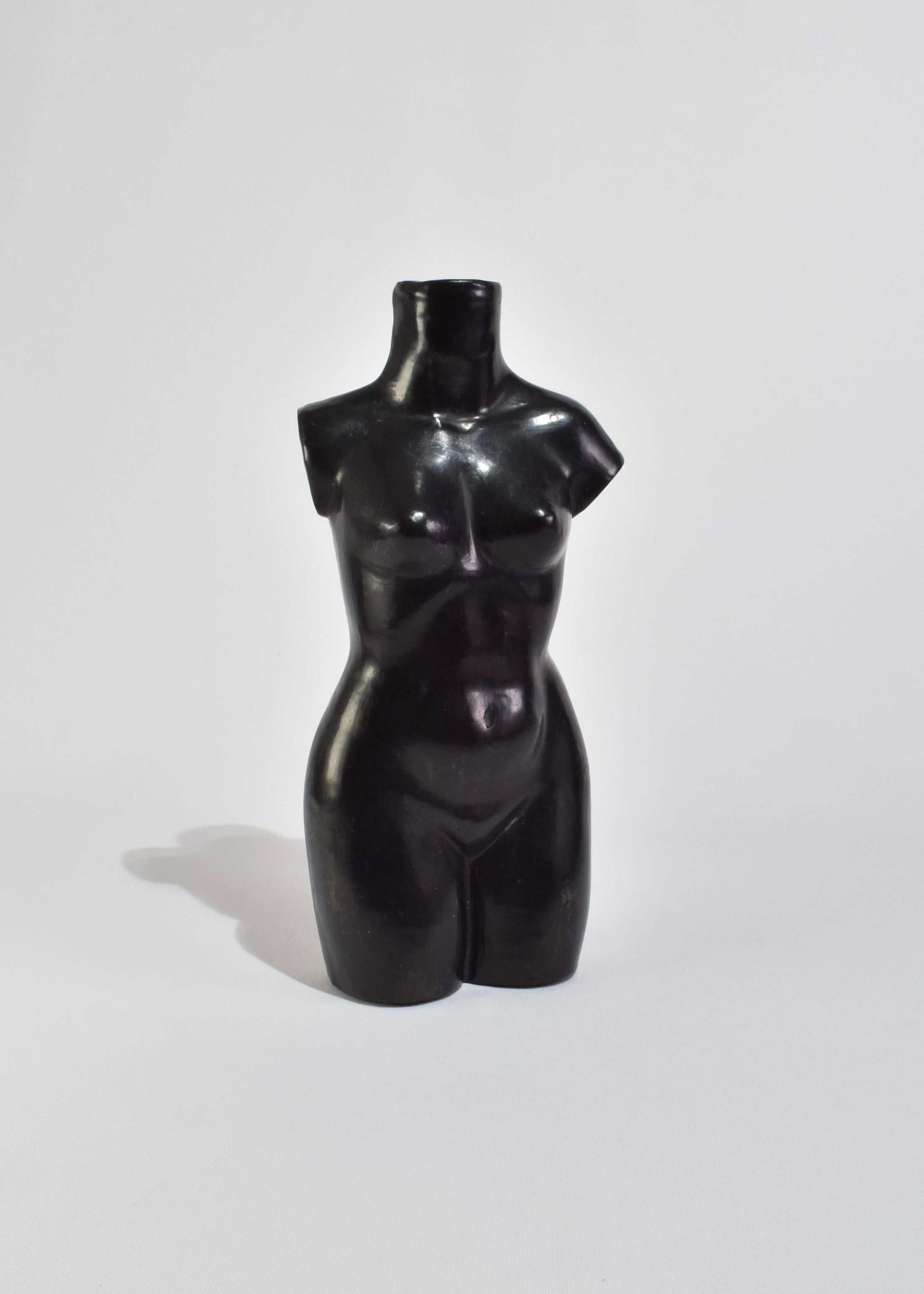 Vintage, handmade clay torso sculpture or vase in black. A beautiful piece displayed on its own or with flowers; we recommend Baby's Breath or Calla Lily. 