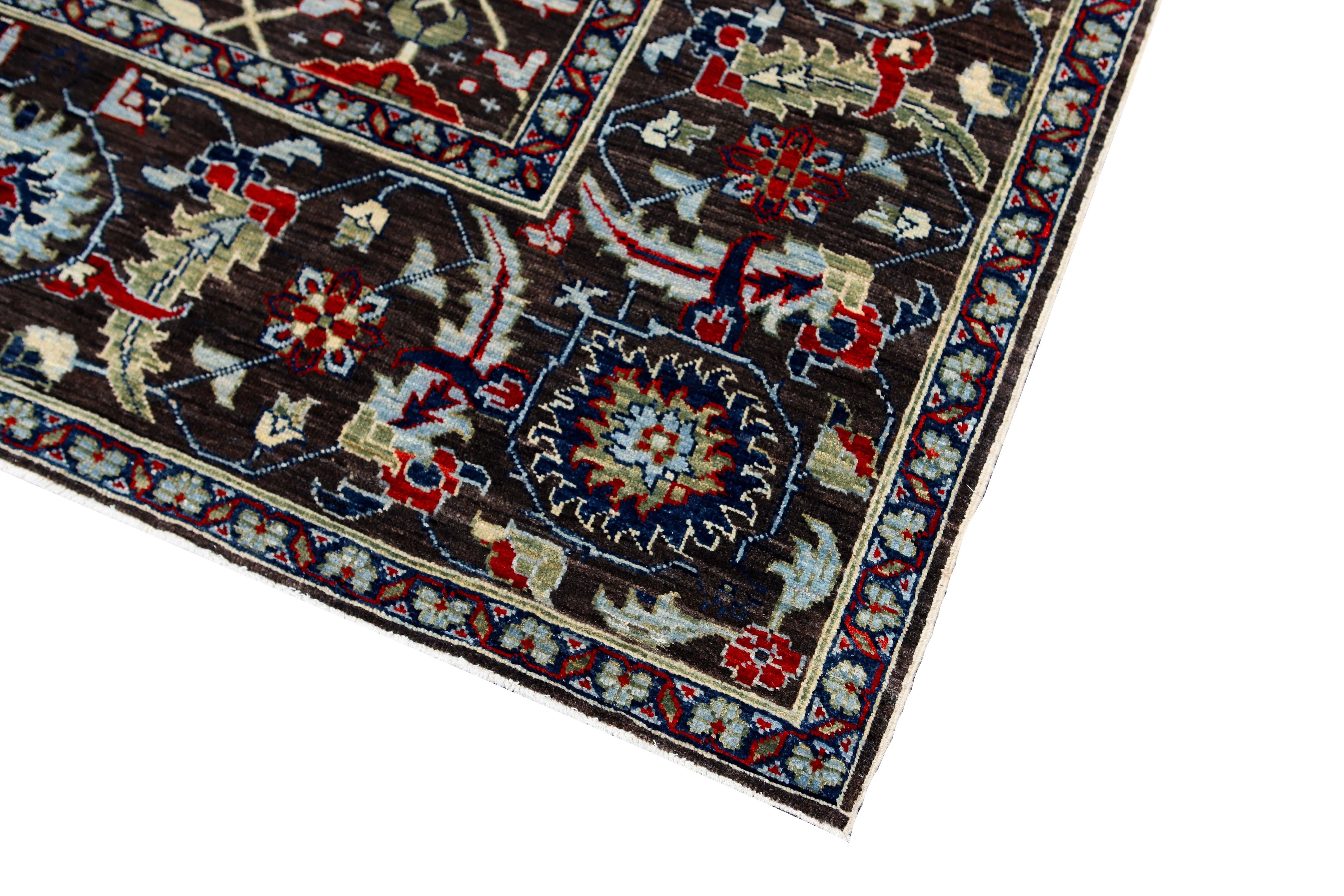 Black transitional Afghan designed 10 x 14 rug.
Hand knotted with hand-spun wool, woven in Afghanistan. This beautifully designed rug will be sure to stand out in any room. Measures: 10'2’ x 13