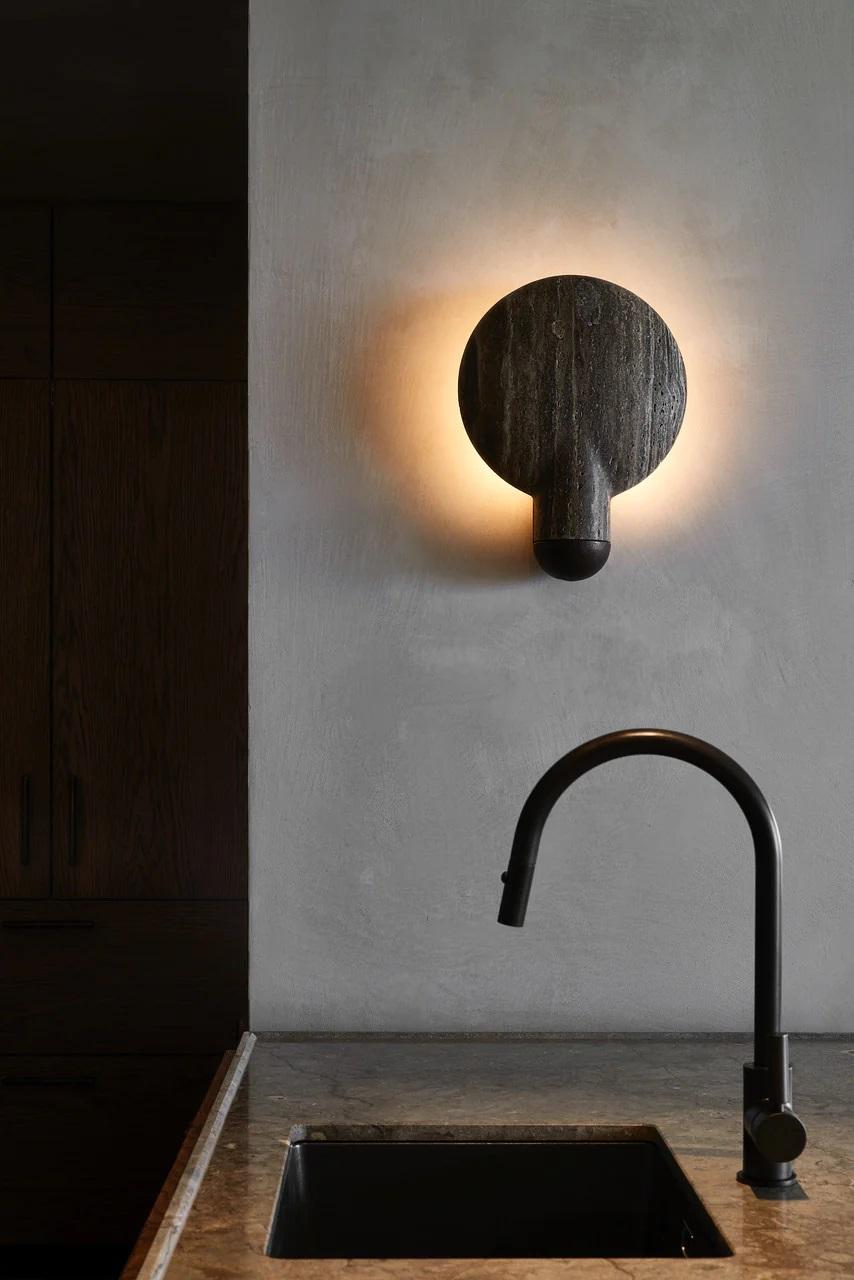 Black Travertine Surface Wall Sconce by Henry Wilson
Dimensions: W 30 x D 11 x H 40 cm
Materials: Black travertine, blackened bronze.

Available in blackened, bronze, aluminum, blackened and travertine, blackened and black travertine.

An ambient,