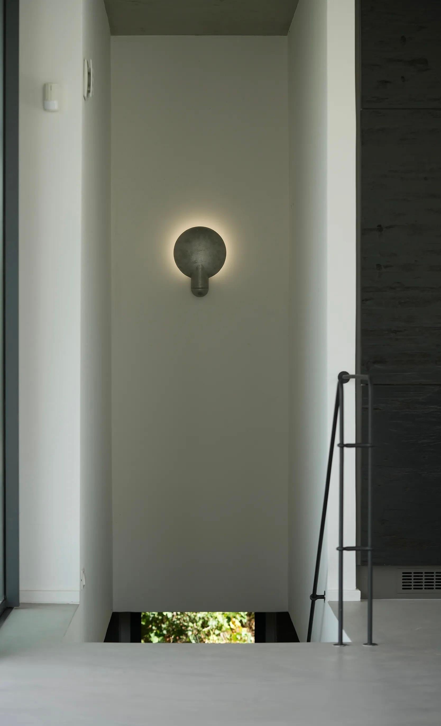 Australian Contemporary Black Travertine Surface Wall Sconce by Henry Wilson For Sale