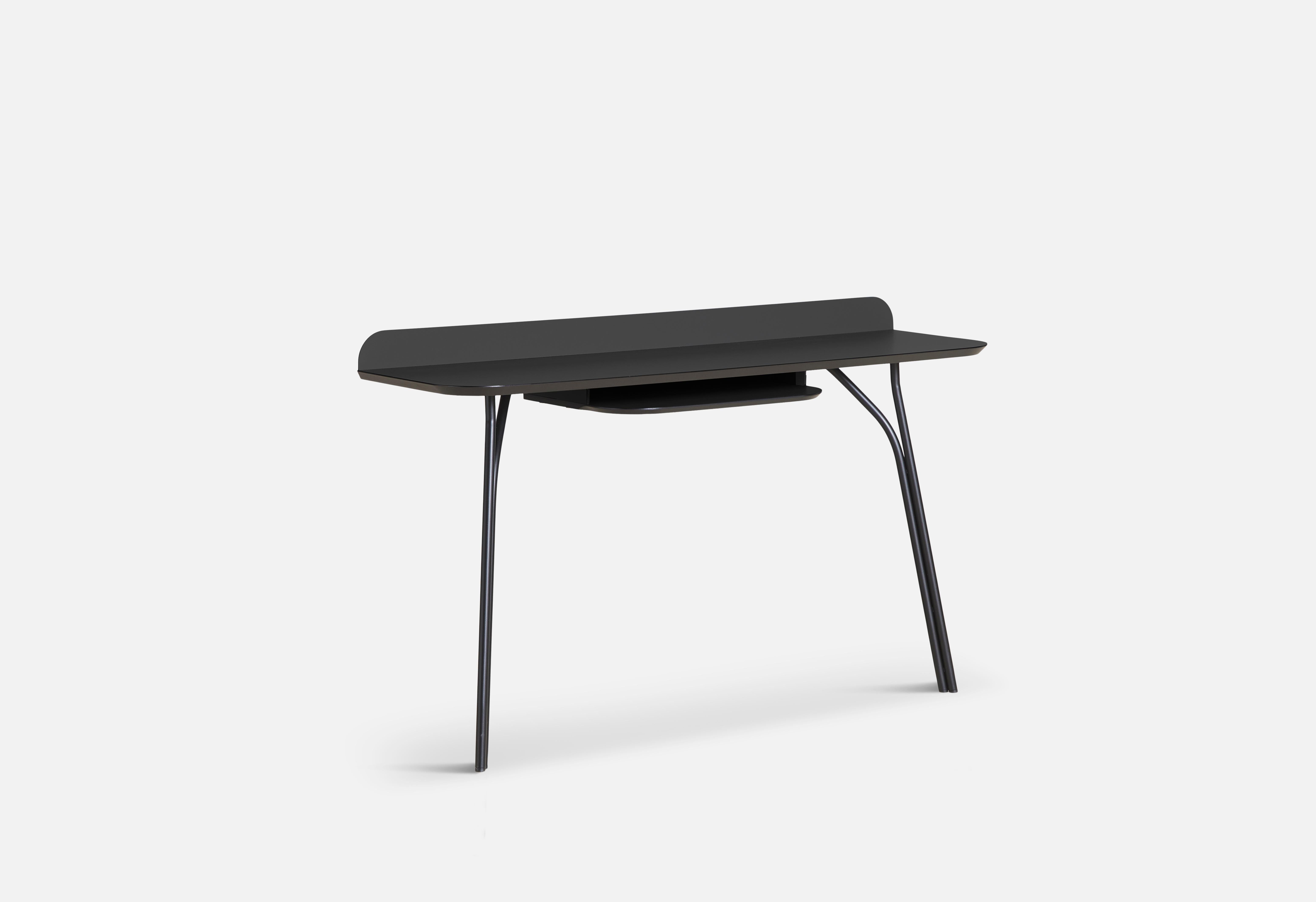 Black tree small console table with shelf by Elisabeth Hertzfeld.
Materials: fenix laminate, metal.
Dimensions: D 40 x W 130 x H 81 cm.

The founders, Mia and Torben Koed, decided to put their 30 years of experience into a new project. It was