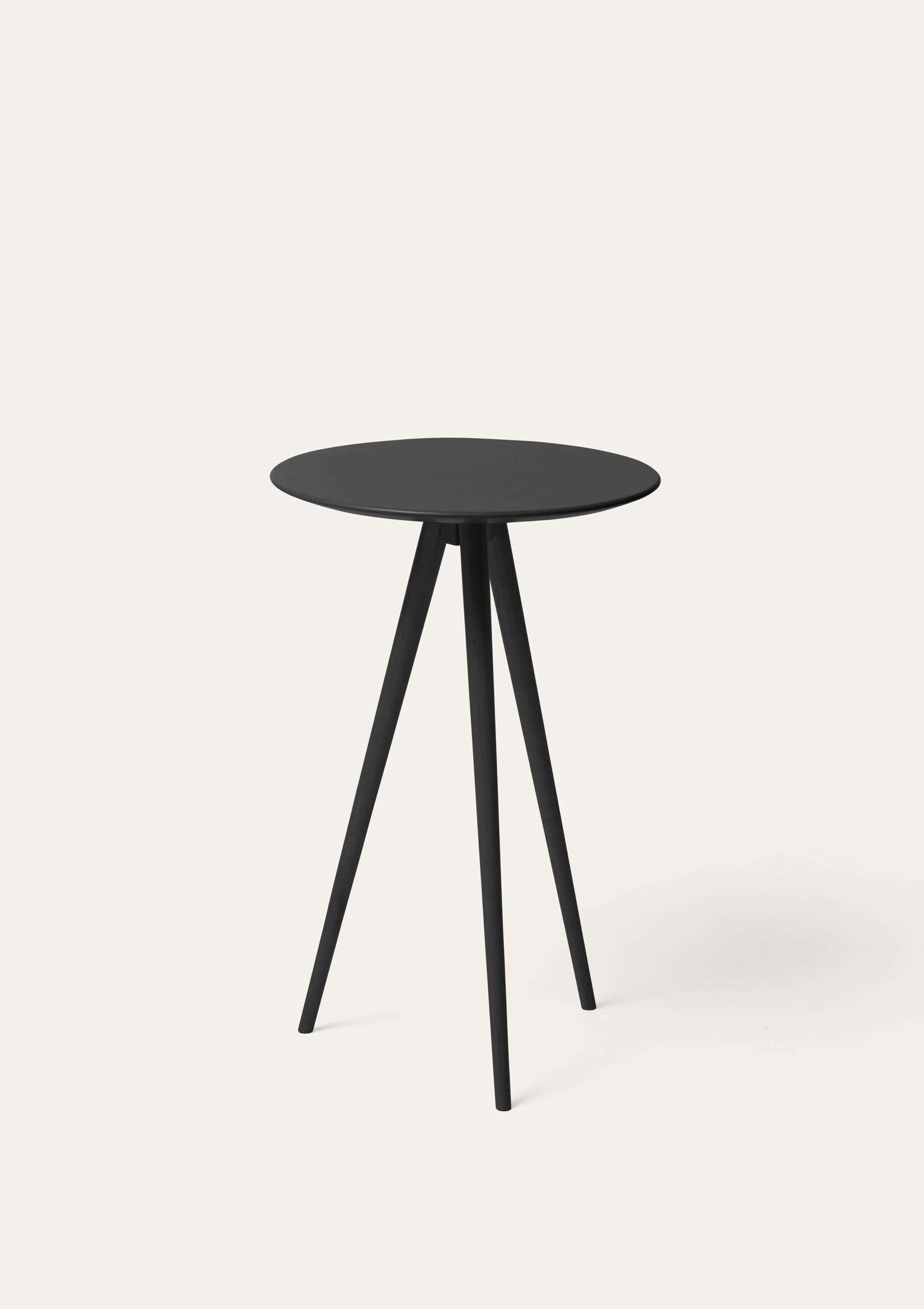Black Trip side table by Storängen Design
Dimensions: D 35 x H 62 cm
Materials: birch wood.
Also available in other colors.

Trip is our smallest table, a lightweight three-legged surface entirely made of birch. A decorative item that can be