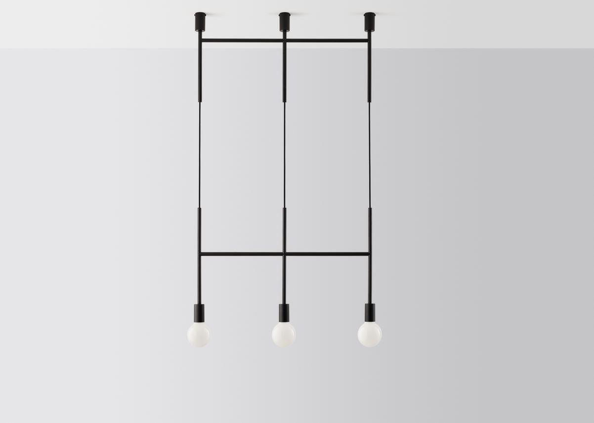 Black triple step by Volker Haug.
Dimensions: W 98.7 x H min 108 cm.
Materials: Polished, bronzed brass or steel.
Finish: Raw, satin lacquer or powdercoat.
Weight: Approx 3.5 kg.

Lamp: 240V E27 (120V E26 US) 
Custom finishes available on