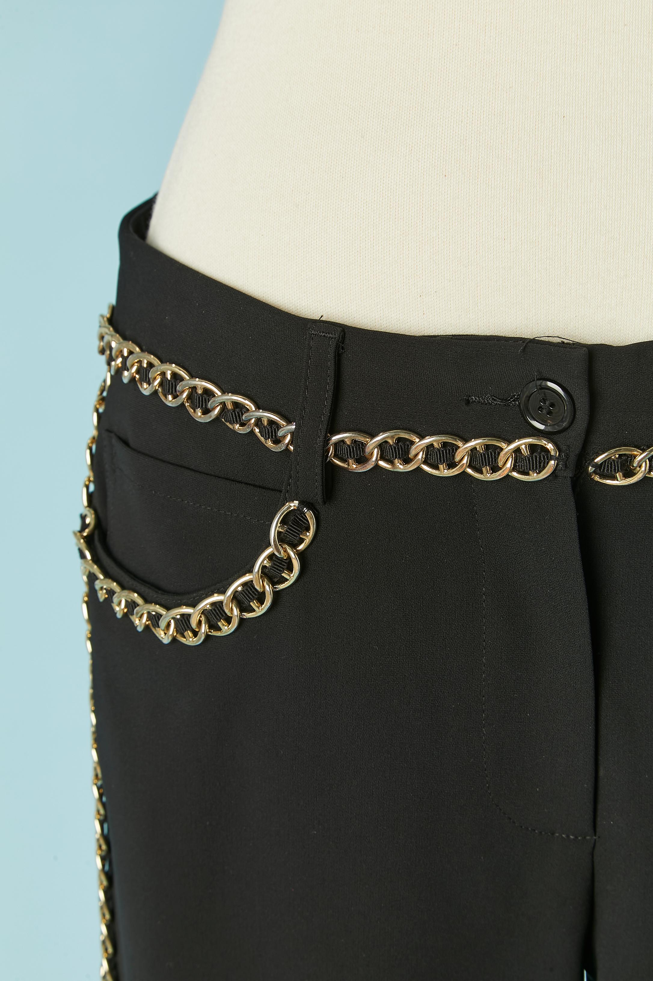 Black trouser with gold metal chain embellishment mixed with black gros-grain.  Fabric composition: 64% triacetate, 36% polyester. 
Pocket on both side + 2 pockets on the back. Button, buttonhole and zip closure on the middle front. Belt loop. 
SIZE