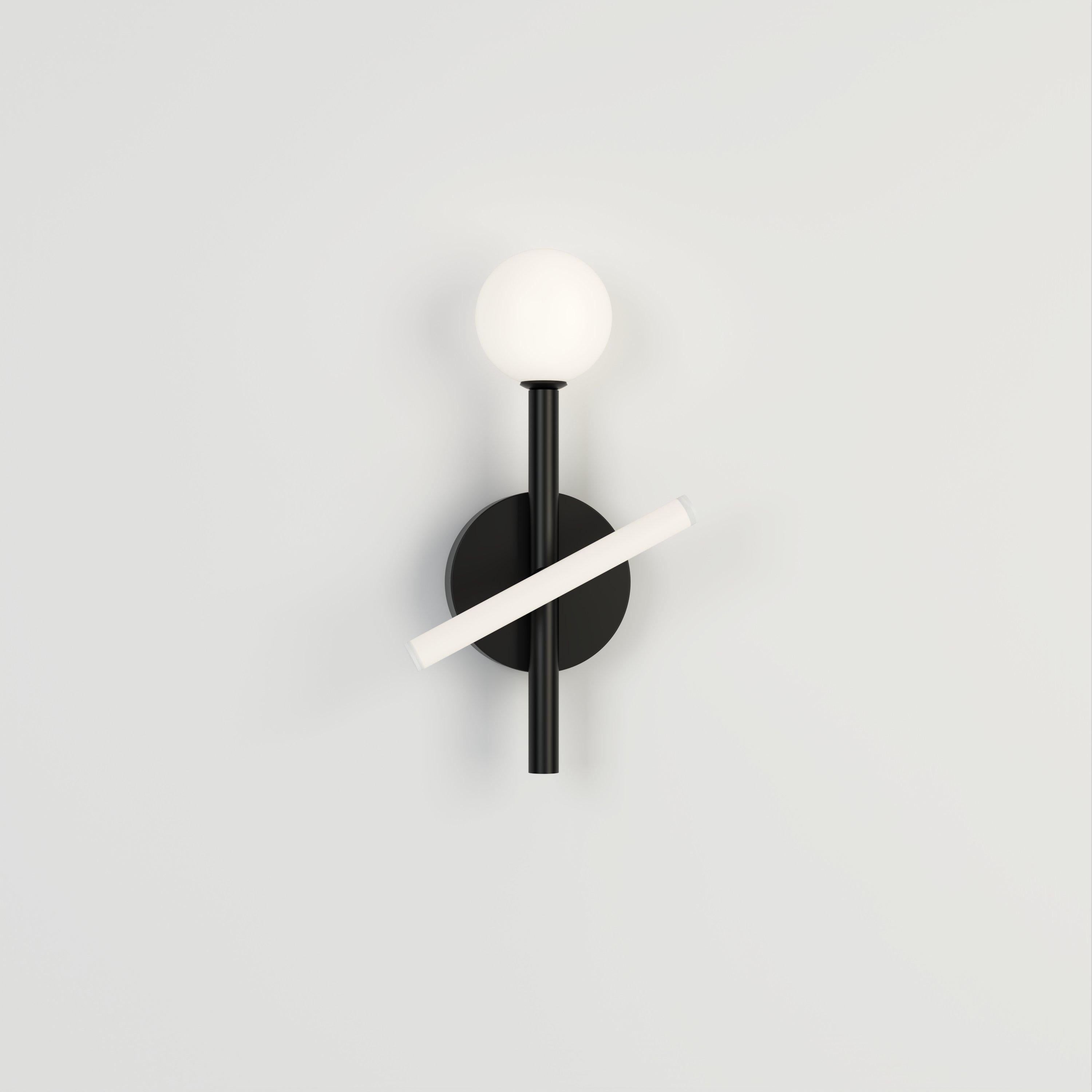 Black Tube and Globe Wall Light by Atelier Areti
Dimensions: D 12 x H 34 cm.
Materials: Powder-coated metal.

Available in other colors. Please contact us.

All our lamps can be wired according to each country. If sold to the USA it will be wired