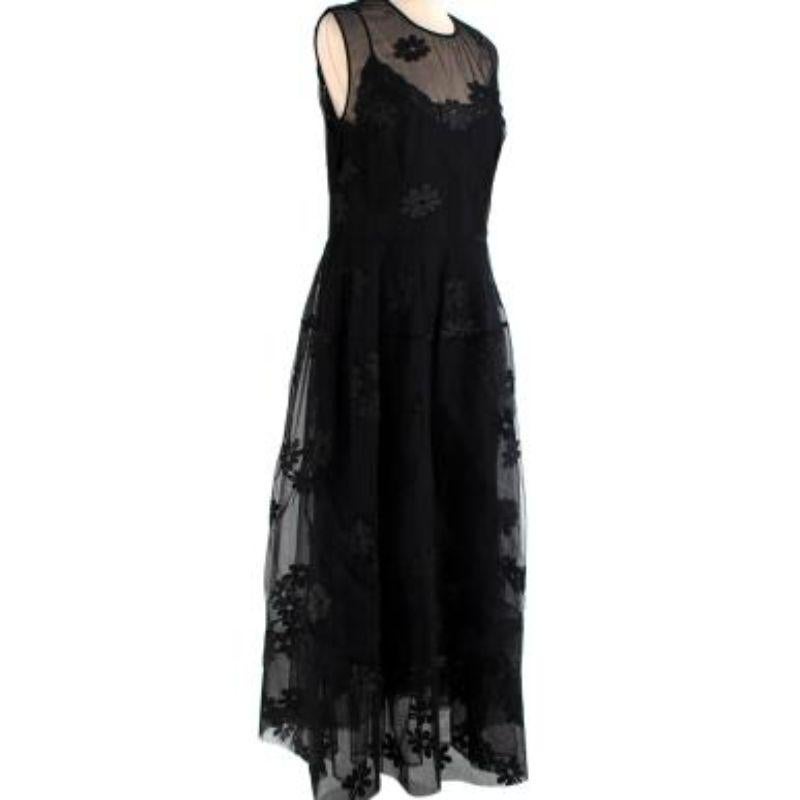 Simone Rocha Black Tulle Floral Embroidered Dress with Slip
 
 -A slip lining with sweetheart neckline with a lace trim
 -Concealed zip fastening along back
 -Non stretch fabric
 -Floral detail embroidery
 -Pleated from the waist
 -Tulle underskirt