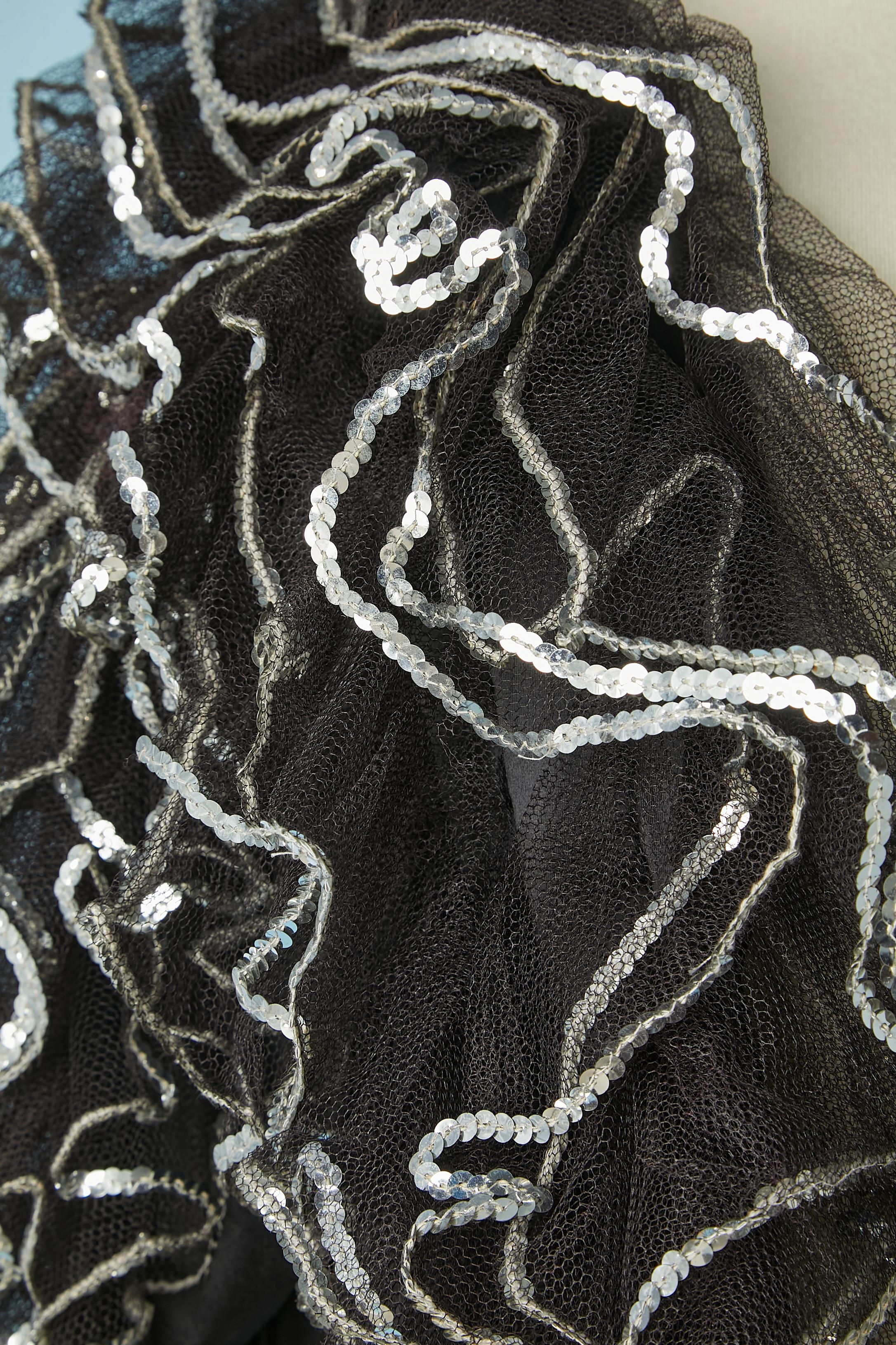 Black tulle ruffles boléro with silver sequin edge. No fabric tag composition but probably polyester base. 
SIZE L