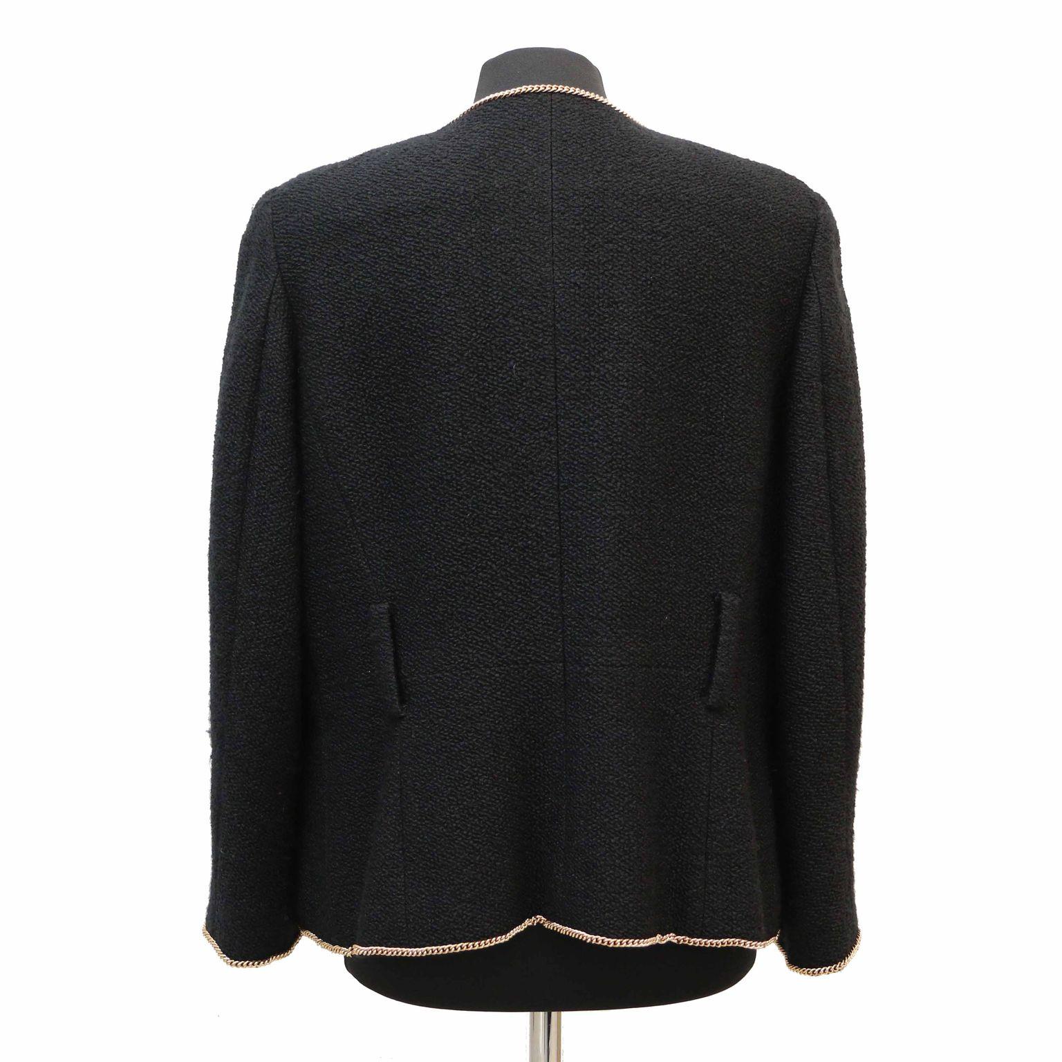 Black Chanel Jacket with gold jewelry in very good condition. Made in France, size 46FR.
Fabric : Wool, alpaca
Lining : 100% silk
Dimensions : Shoulders : 46cm, under the chest : 58cm, height : 60cm, sleeves length : 58cm, wrists circumference :