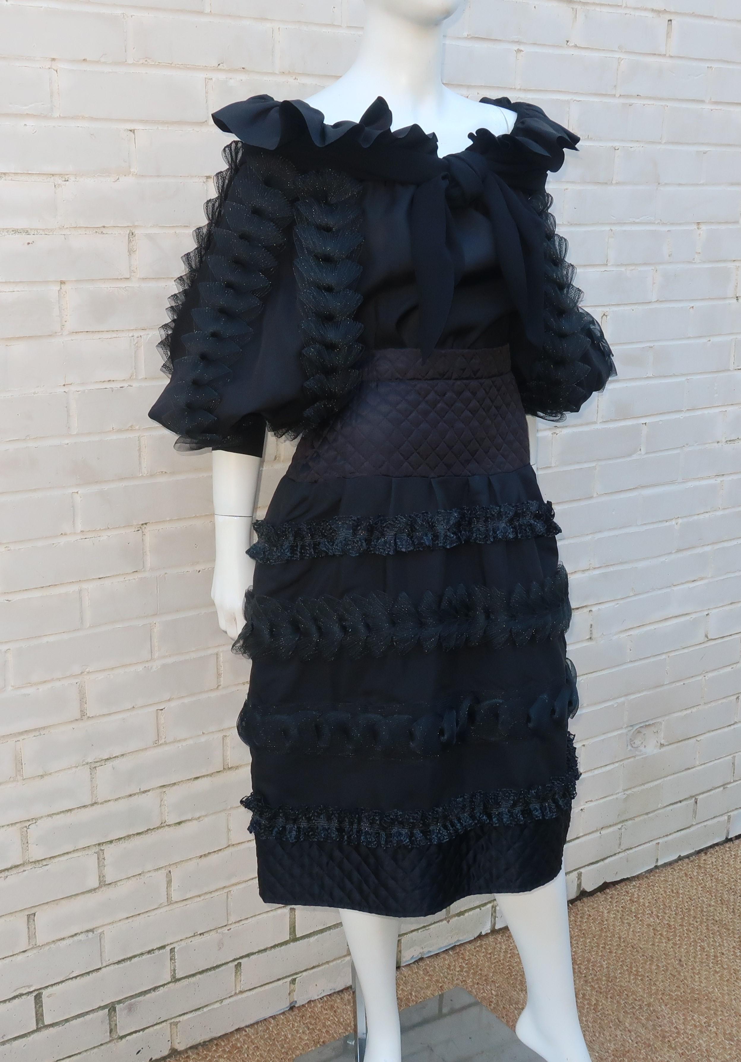 There is a whole lot of 1980's 'fabulousness' going on with this two piece black ruffled dress which consists of an off-the-shoulder blouse and partly quilted skirt.  The blouse is constructed with an elasticized built-in shawl collar (see it untied