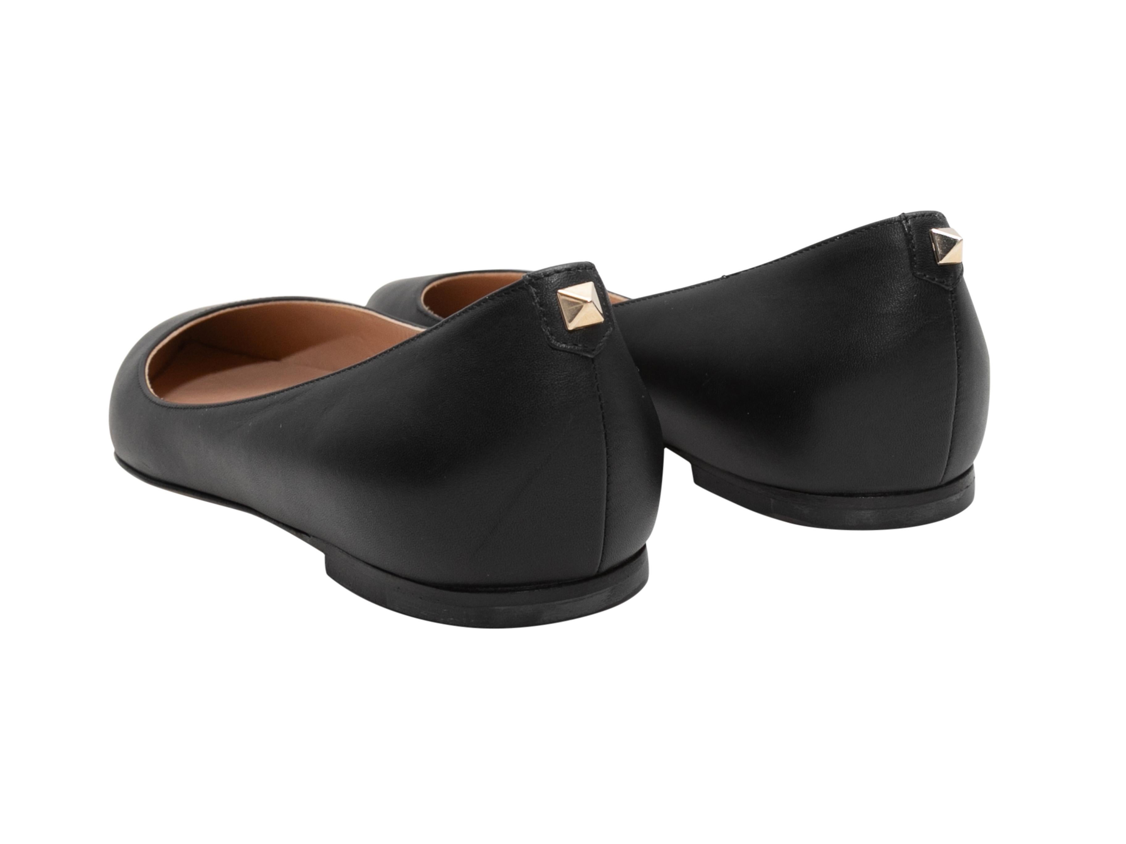 Black pointed-toe leather ballet flats by Valentino.

Designer Size: 37
US Recommended Size: 7
