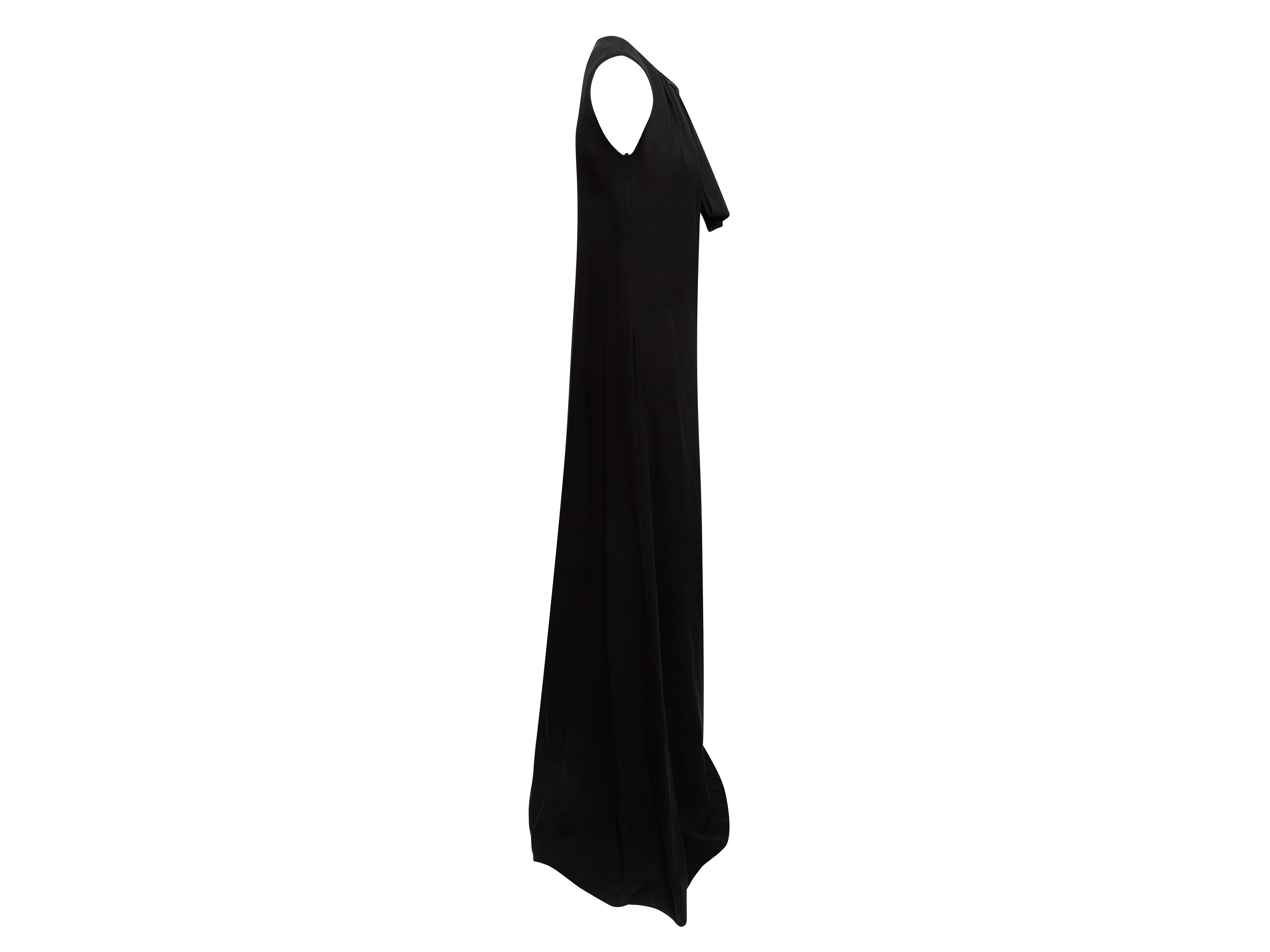 Product Details: Black silk tie neck sleeveless gown by Valentino. Crew neck. Zip closure at center back. Designer size 40. 34