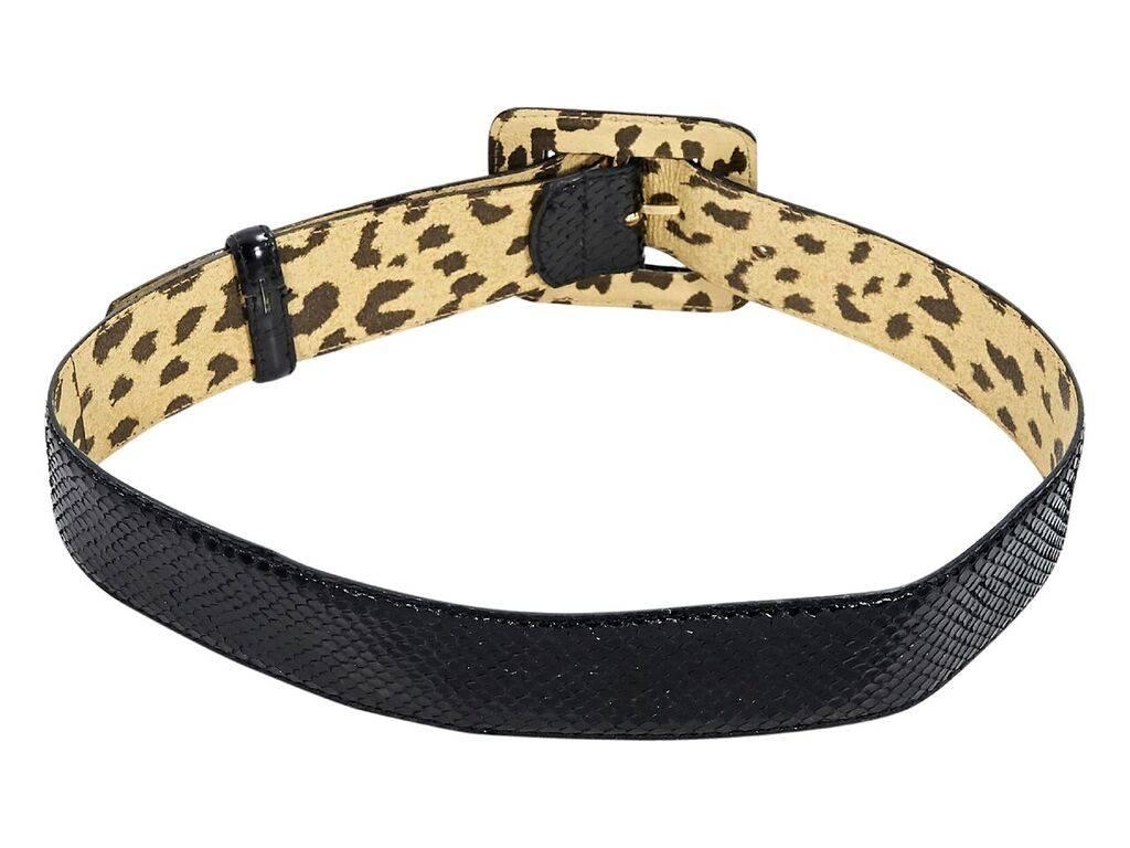 Product details:  Black snakeskin belt by Valentino.  Adjustable buckle closure.  Goldtone hardware.  1.5